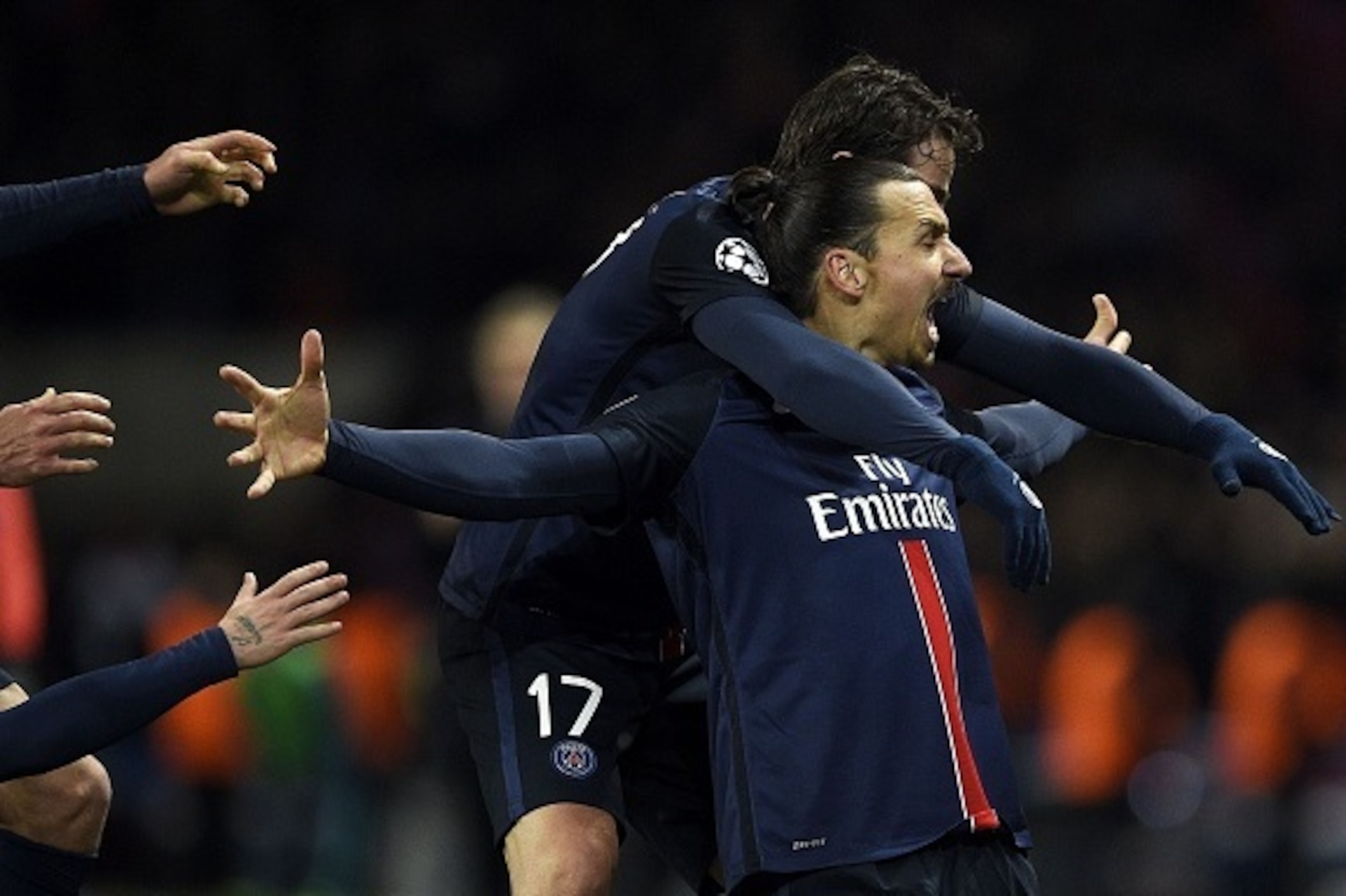Paris Saint-Germain's Swedish forward Zlatan Ibrahimovic (R) celebrates with teammates after scoring a goal during the Champions League round of 16 first leg football match between Paris Saint-Germain (PSG) and Chelsea FC on February 16, 2016, at the Par Paris Saint-Germain's Swedish forward Zlatan Ibrahimovic (R) celebrates with teammates after scoring a goal during the Champions League round of 16 first leg football match between Paris Saint-Germain (PSG) and Chelsea FC on February 16, 2016, at the Par