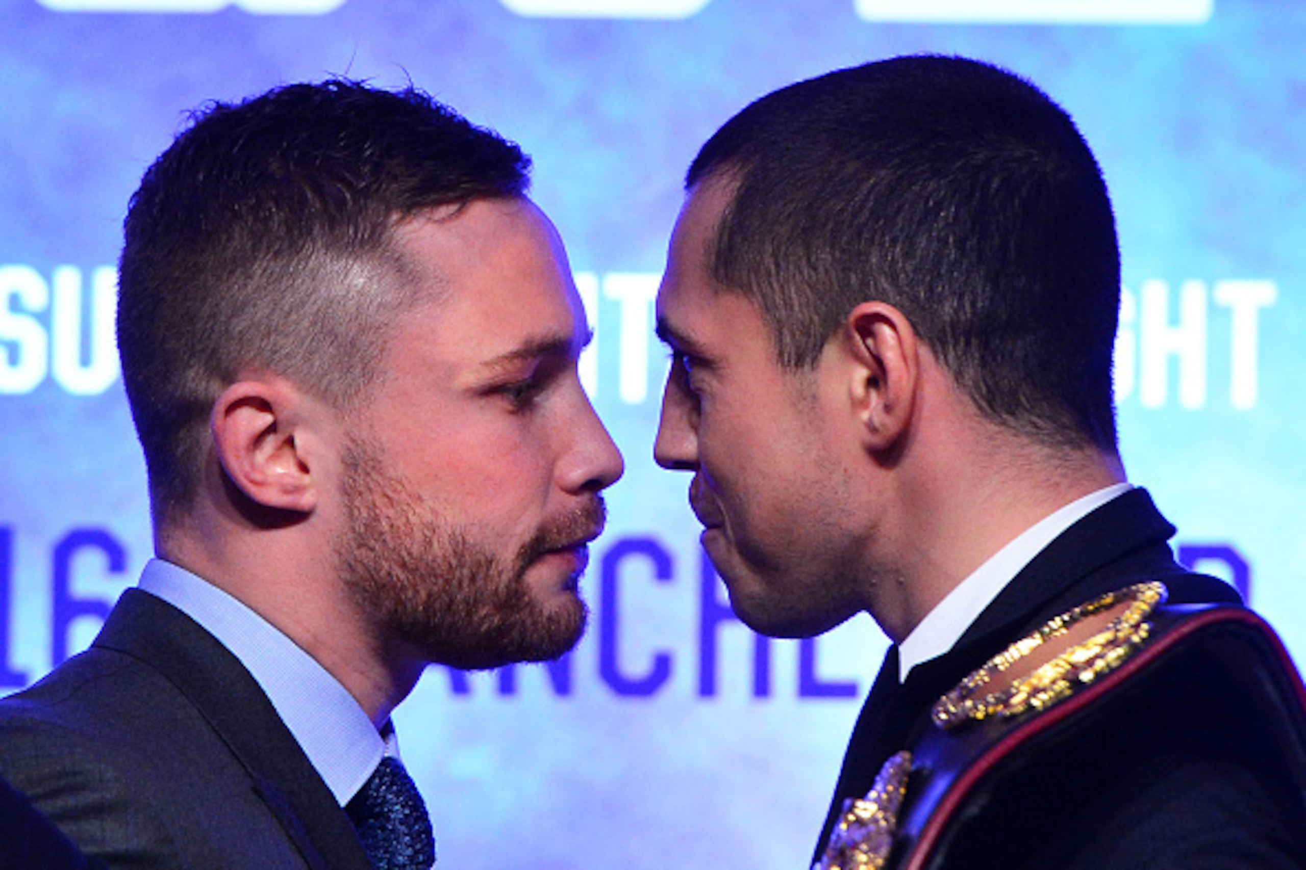 BELFAST, NORTHERN IRELAND - NOVEMBER 18:  Carl Frampton (L) and Scott Quigg (R) exchange heated words during the WBA and IBF super-bantamweight world title unification pre-fight press conference at Europa Hotel on November 18, 2015 in Belfast, Northern Ir