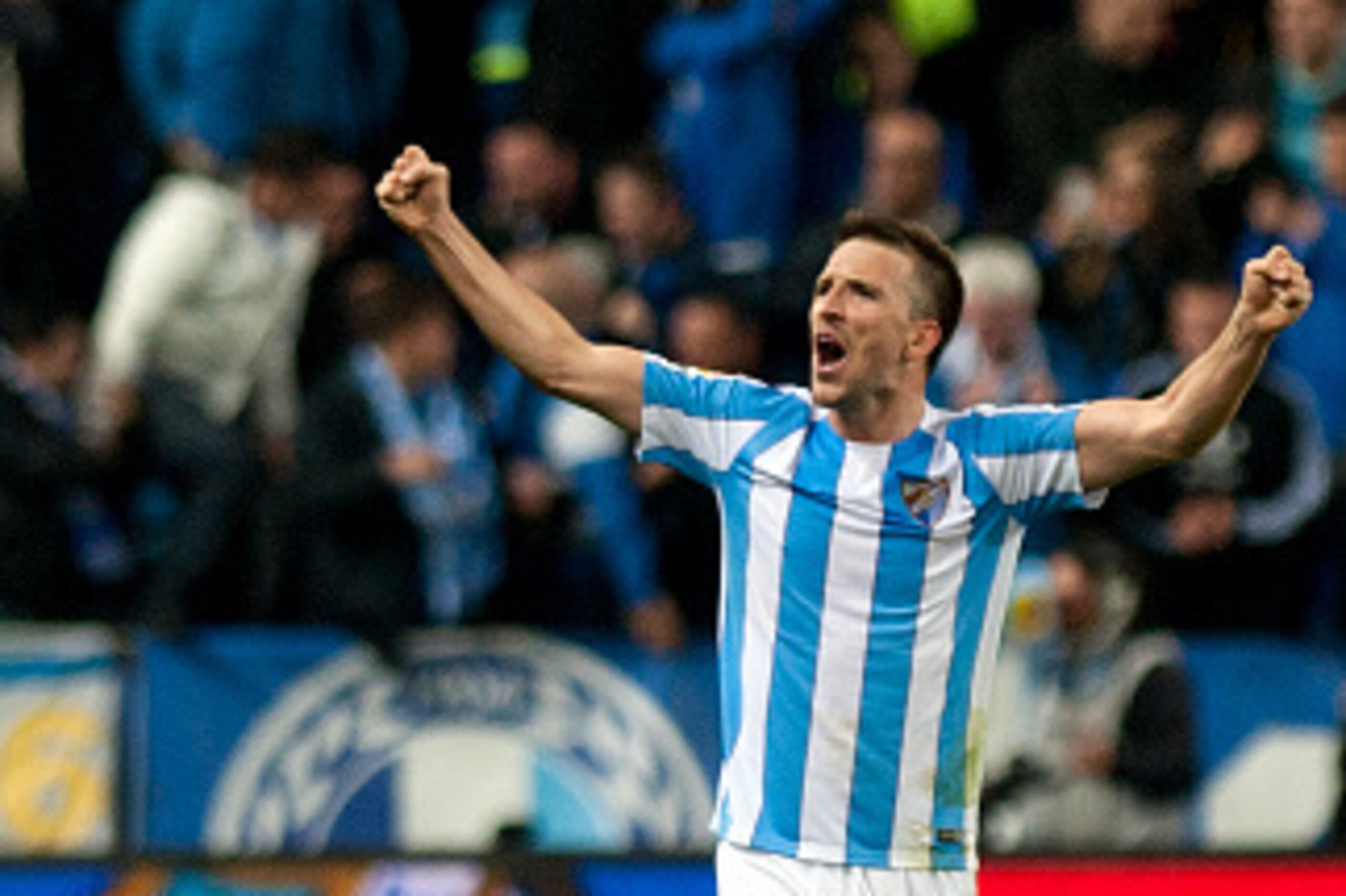 Malaga's midfielder Ignacio Camacho celebrates after winning 1-0 the Spanish league football match Malaga CF vs Club Atletico de Madrid at La Rosaleda stadium in Malaga on December 20, 2015.   AFP PHOTO / JORGE GUERRERO / AFP / Jorge Guerrero        (Phot