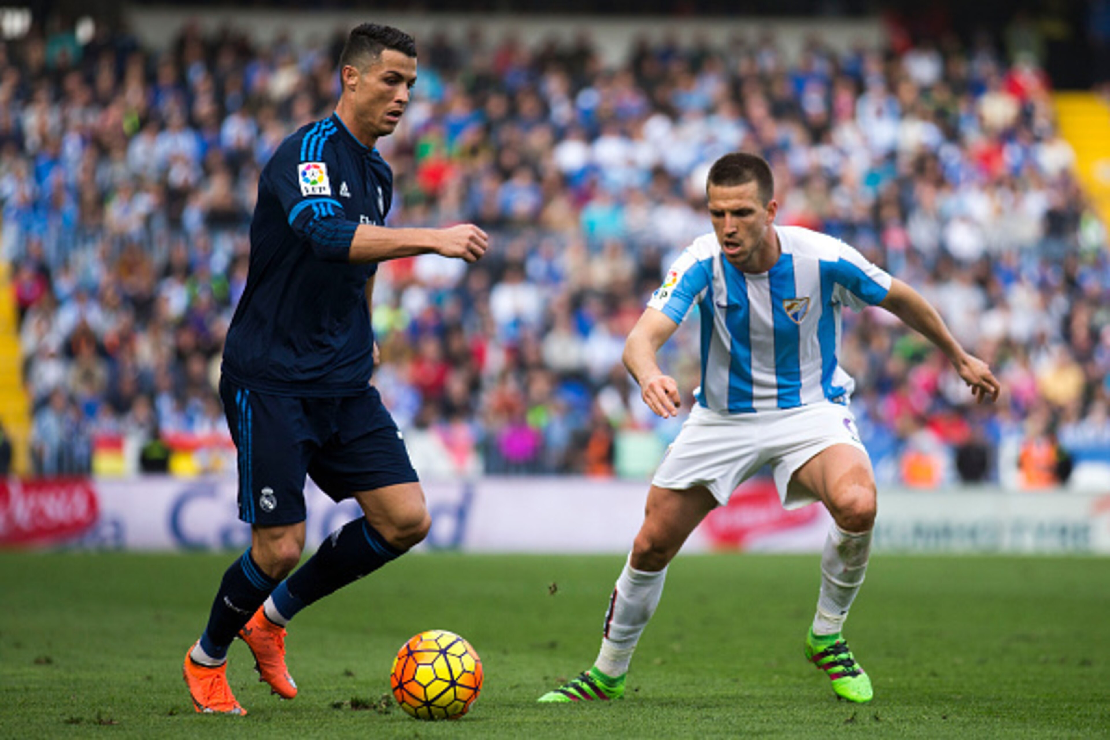 MALAGA, SPAIN - FEBRUARY 21: Cristiano Ronaldo (L) of Real Madrid CF Ignacio Camacho (R) of Malaga CF during the La Liga match between Malaga CF and Real Madrid CF at La Rosaleda Stadium on February 21, 2016 in Malaga, Spain.  (Photo by Gonzalo Arroyo Mor