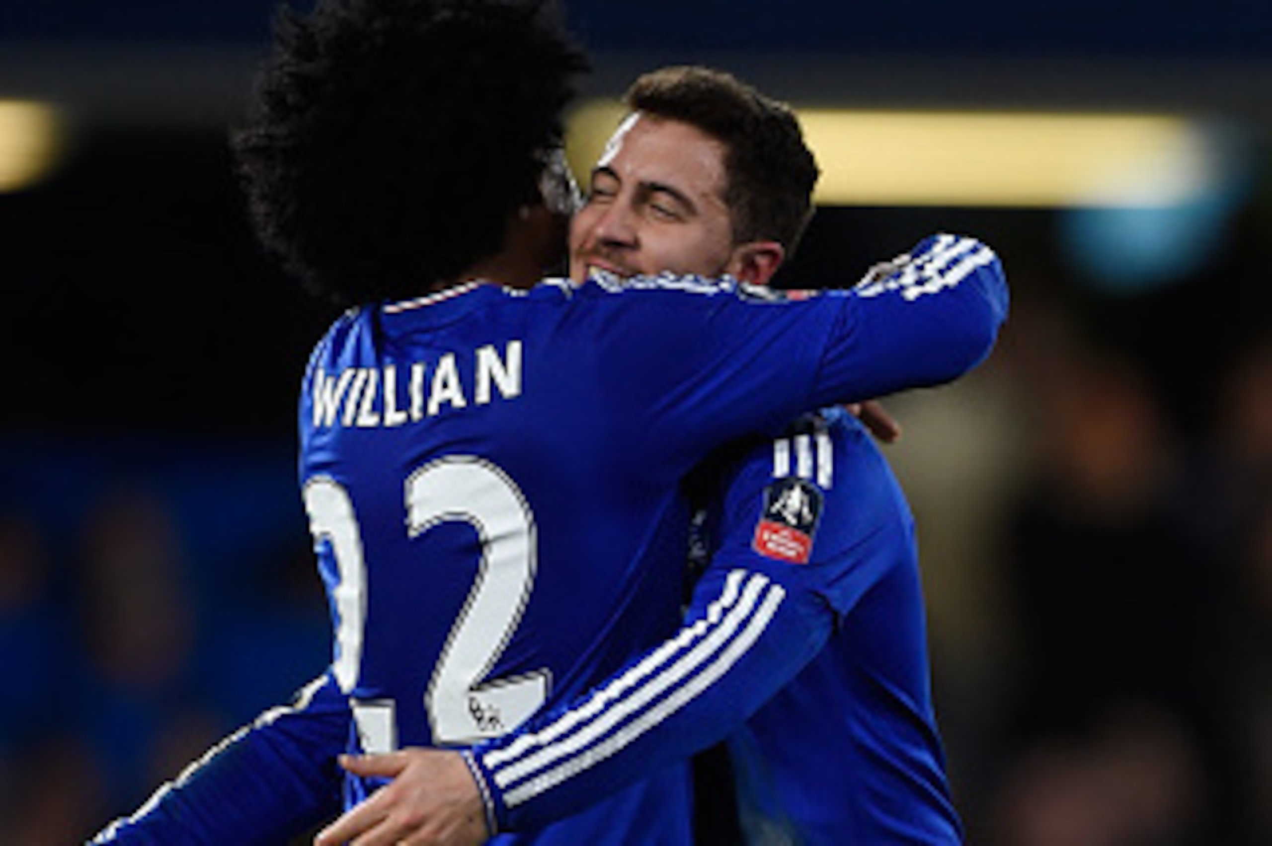 LONDON, ENGLAND - FEBRUARY 21:  Eden Hazard of Chelsea is congratulated by teammate Willian (L) after scoring his team's fourth goal during The Emirates FA Cup fifth round match between Chelsea and Manchester City at Stamford Bridge on February 21, 2016 i