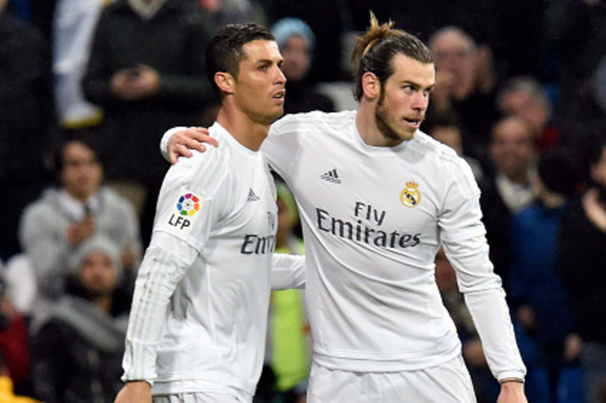 Real Madrid's Welsh forward Gareth Bale (R) celebrates a goal with Real Madrid's Portuguese forward Cristiano Ronaldo during the Spanish league football match Real Madrid CF vs RC Deportivo La Coruna at the Santiago Bernabeu stadium in Madrid on January 9 Real Madrid's Welsh forward Gareth Bale (R) celebrates a goal with Real Madrid's Portuguese forward Cristiano Ronaldo during the Spanish league football match Real Madrid CF vs RC Deportivo La Coruna at the Santiago Bernabeu stadium in Madrid on January 9