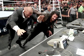 Roman Reigns attacks Triple H at TLC.