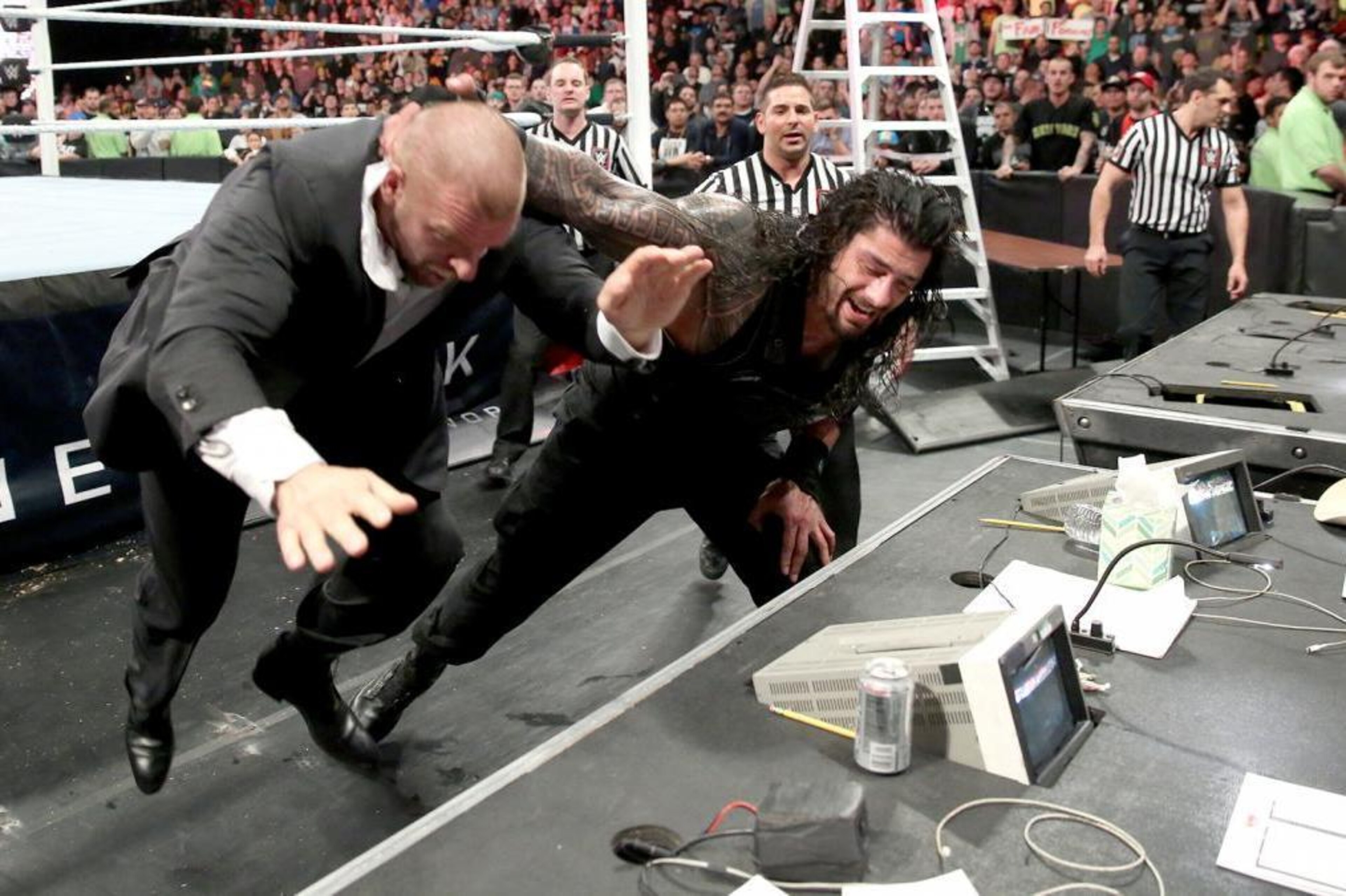 Roman Reigns attacks Triple H at TLC.