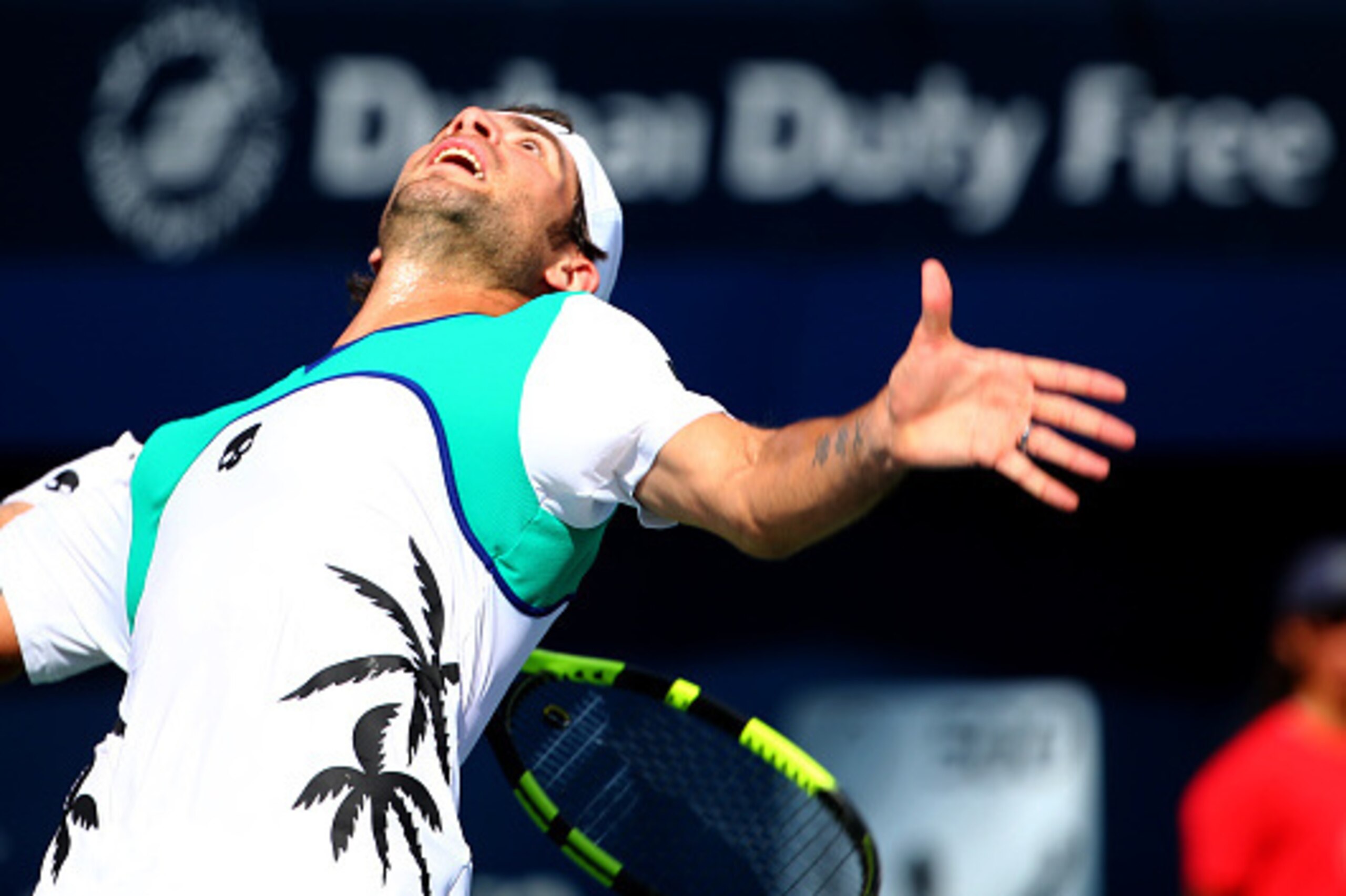 Italian Simone Bolelli serves the ball to Spanish Roberto Bautista Agut during their ATP tennis match on the second round of the Dubai Duty Free Tennis Championships February 23, 2016. / AFP / MARWAN NAAMANI (Photo credit should read MARWAN NAAMAN Italian Simone Bolelli serves the ball to Spanish Roberto Bautista Agut during their ATP tennis match on the second round of the Dubai Duty Free Tennis Championships February 23, 2016. / AFP / MARWAN NAAMANI (Photo credit should read MARWAN NAAMAN