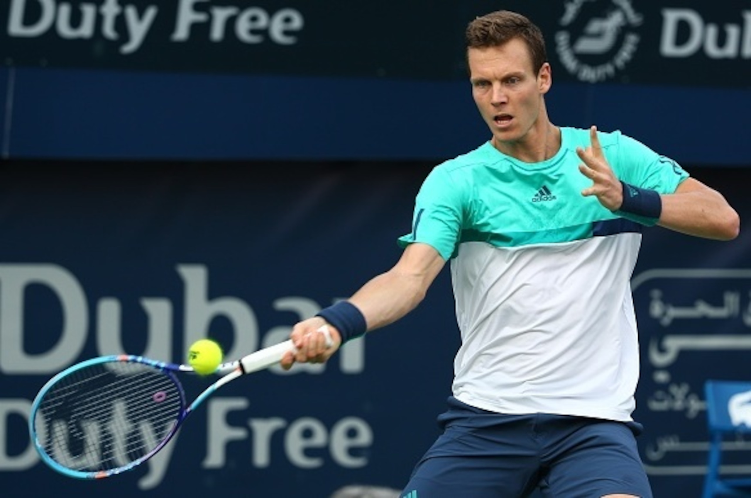 Czech tennis player Tomas Berdych returns the ball to Portuguese Joao Sousa during their ATP tennis match on the second round of the Dubai Duty Free Tennis Championships on February 23, 2016. / AFP / MARWAN NAAMANI (Photo credit should read MARW Czech tennis player Tomas Berdych returns the ball to Portuguese Joao Sousa during their ATP tennis match on the second round of the Dubai Duty Free Tennis Championships on February 23, 2016. / AFP / MARWAN NAAMANI (Photo credit should read MARW