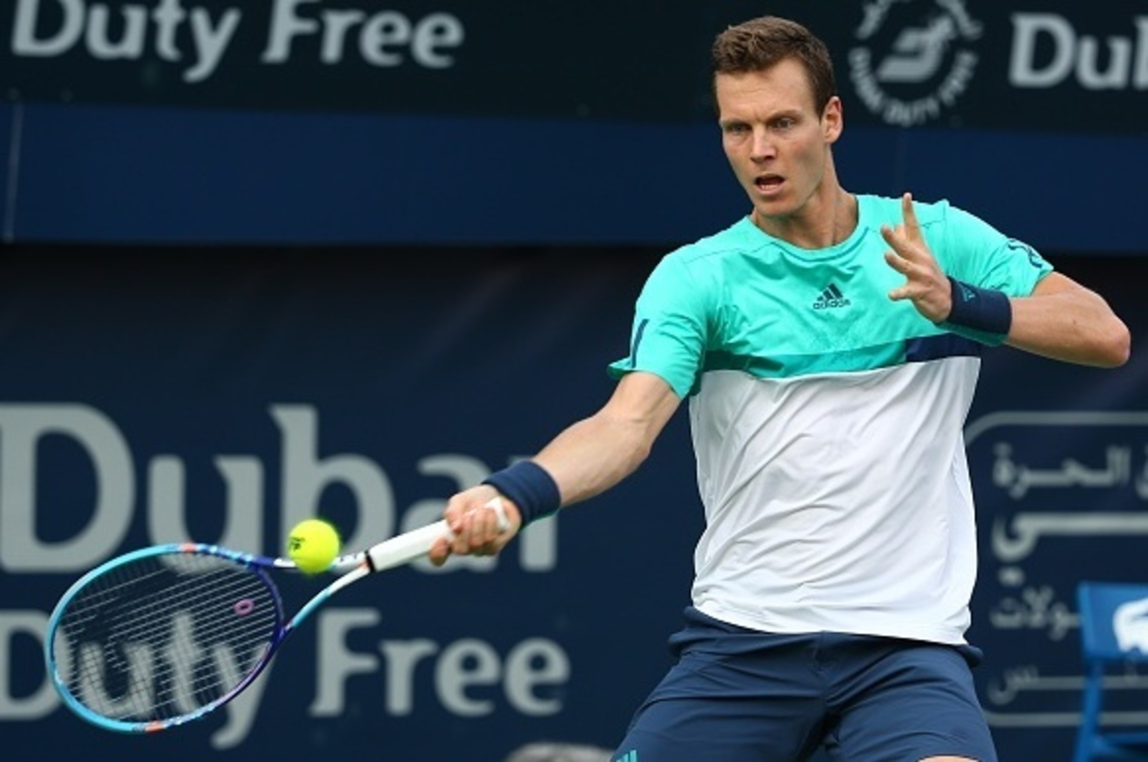 Czech tennis player Tomas Berdych returns the ball to Portuguese Joao Sousa during their ATP tennis match on the second round of the Dubai Duty Free Tennis Championships on February 23, 2016.    / AFP / MARWAN NAAMANI        (Photo credit should read MARW