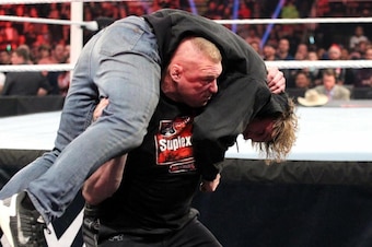 Brock Lesnar prepares to F-5 Dean Ambrose.