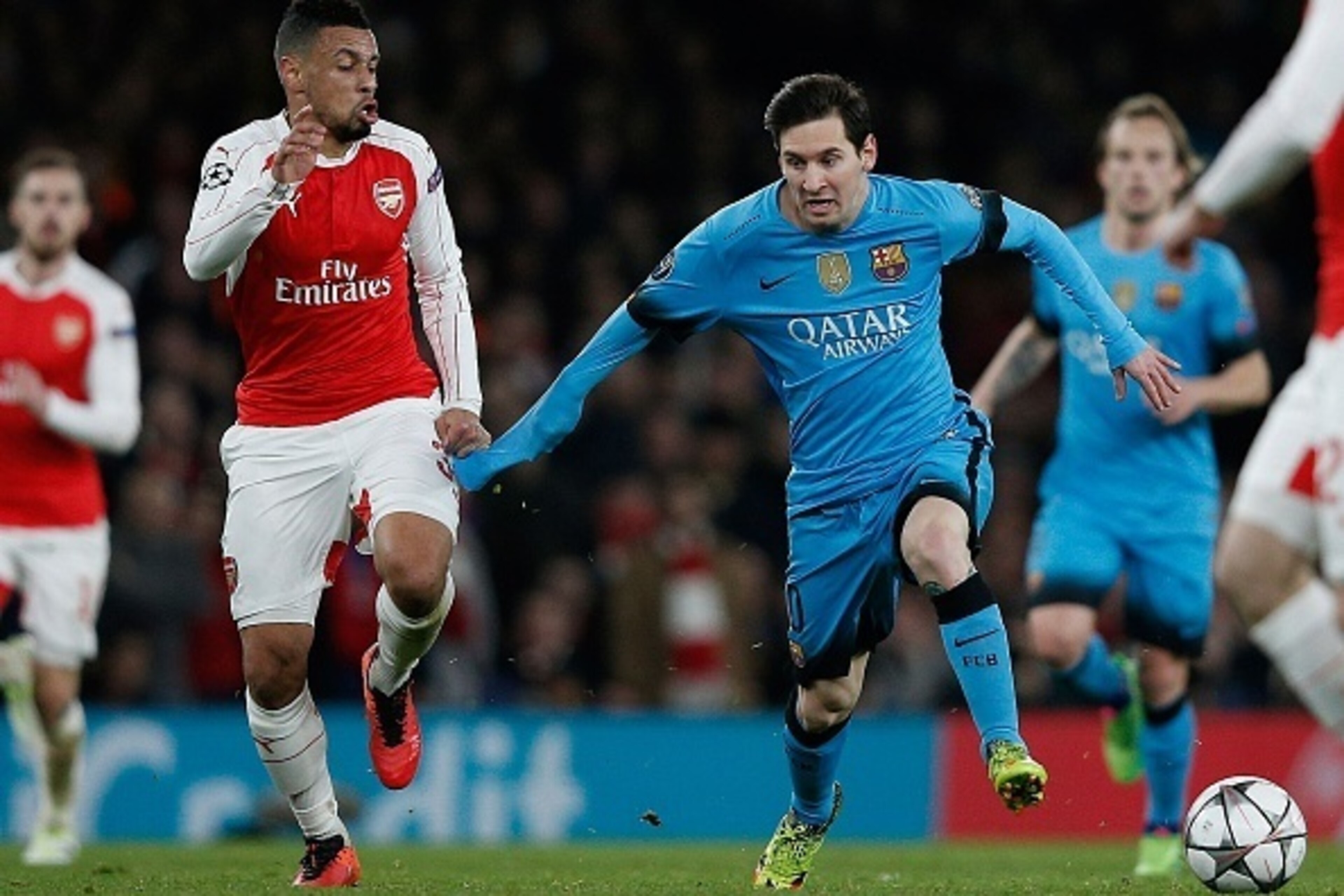 Arsenal's French midfielder Francis Coquelin (L) vies with Barcelona's Argentinian forward Lionel Messi during the UEFA Champions League round of 16 1st leg football match between Arsenal and Barcelona at the Emirates Stadium in London on February 23, 201 Arsenal's French midfielder Francis Coquelin (L) vies with Barcelona's Argentinian forward Lionel Messi during the UEFA Champions League round of 16 1st leg football match between Arsenal and Barcelona at the Emirates Stadium in London on February 23, 201