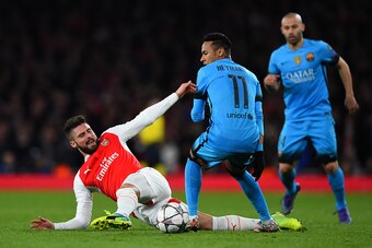 LONDON, ENGLAND - FEBRUARY 23:  Olivier Giroud of Arsenal goes down under the tackle from Neymar of Barcelona during the UEFA Champions League round of 16, first leg match between Arsenal FC and FC Barcelona at the Emirates Stadium on February 23, 2016 in