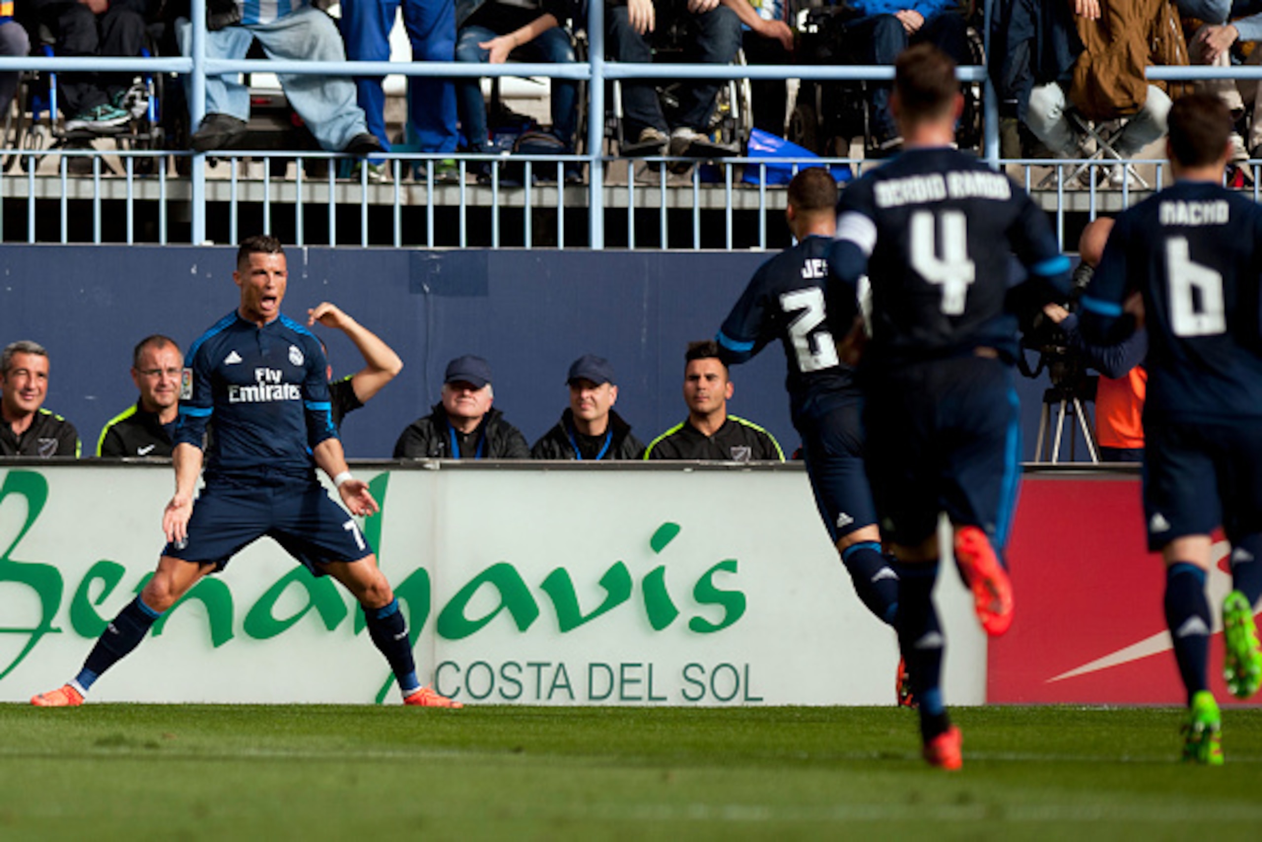 Real Madrid's Portuguese forward Cristiano Ronaldo (L) celebrates a goal during the Spanish league football match Malaga CF vs Real Madrid CF at La Rosaleda stadium in Malaga on February 21, 2016. / AFP / JORGE GUERRERO        (Photo credit should read JO