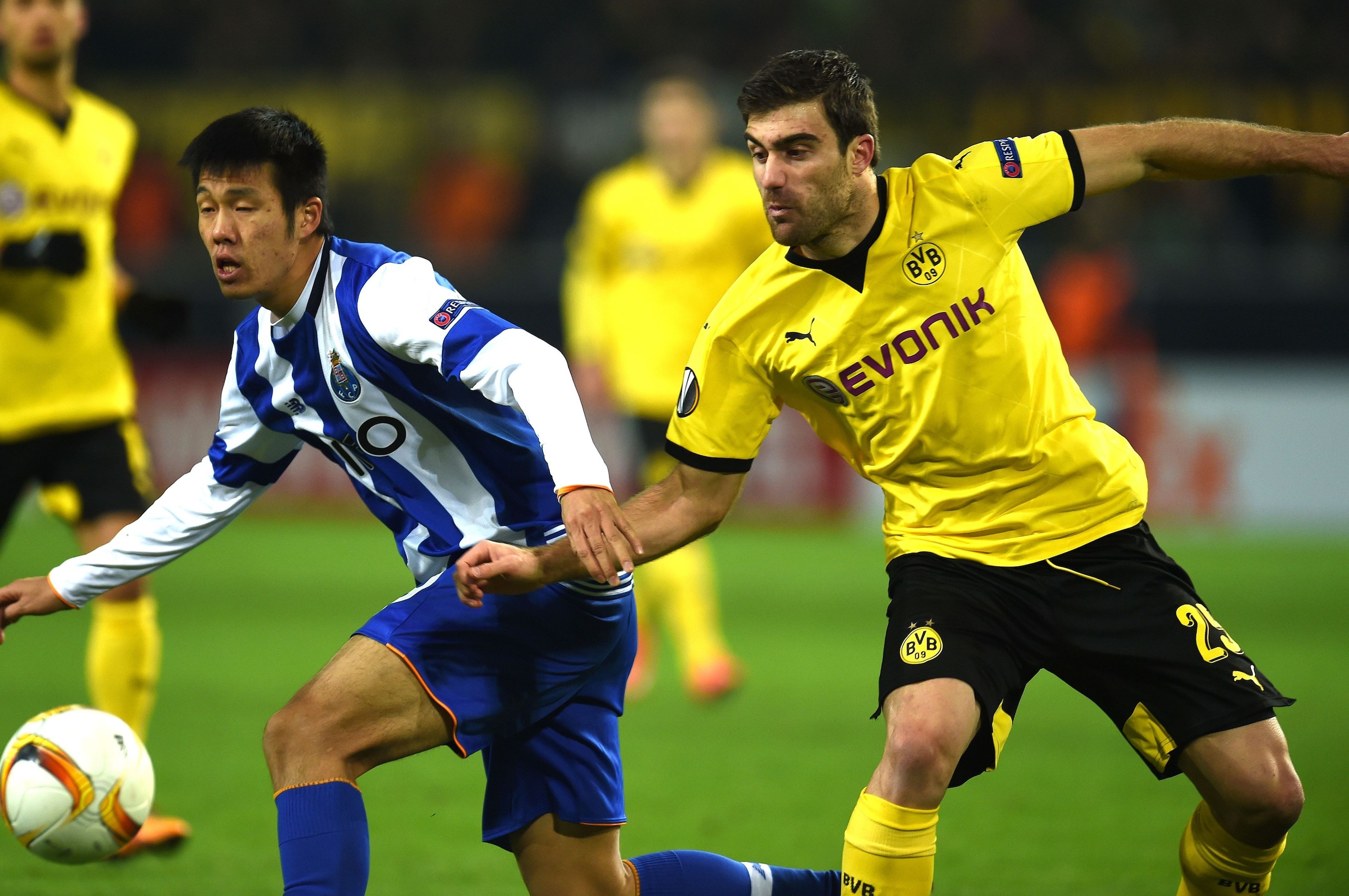 Dortmund's Greek defender Sokratis vies with Porto´s Hyun Jun Suk during the UEFA Europa League Round of 32 football match between Borussia Dortmund and FC Porto in Dortmund, western Germany on February 18, 2016. 

 / AFP / PATRIK STOLLARZ        (Photo c
