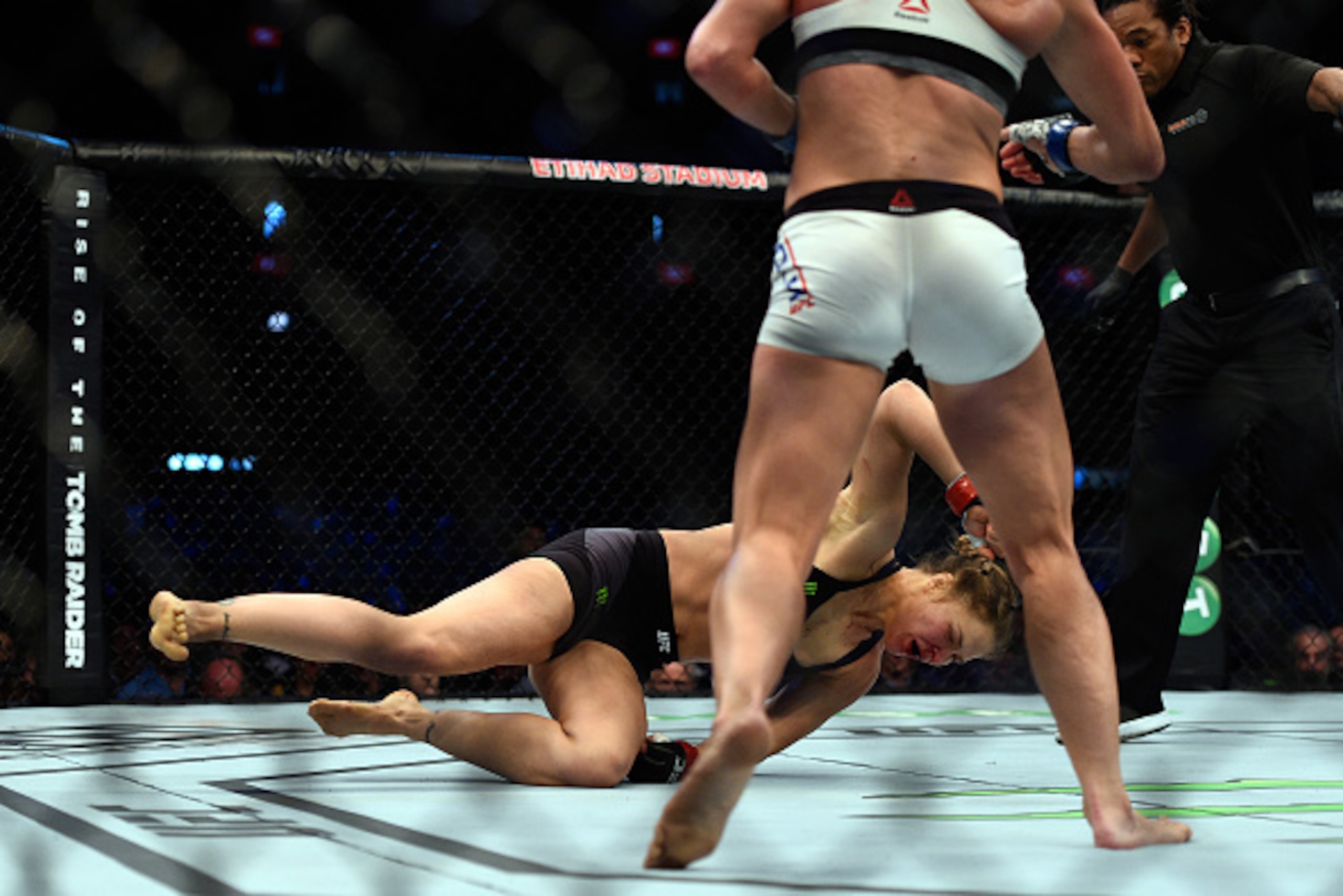 MELBOURNE, AUSTRALIA - NOVEMBER 15: (L-R) Ronda Rousey falls to the mat as she is knocked out by Holly Holm in their UFC women's bantamweight championship bout during the UFC 193 event at Etihad Stadium on November 15, 2015 in Melbourne, Australia. (Phot MELBOURNE, AUSTRALIA - NOVEMBER 15: (L-R) Ronda Rousey falls to the mat as she is knocked out by Holly Holm in their UFC women's bantamweight championship bout during the UFC 193 event at Etihad Stadium on November 15, 2015 in Melbourne, Australia. (Phot
