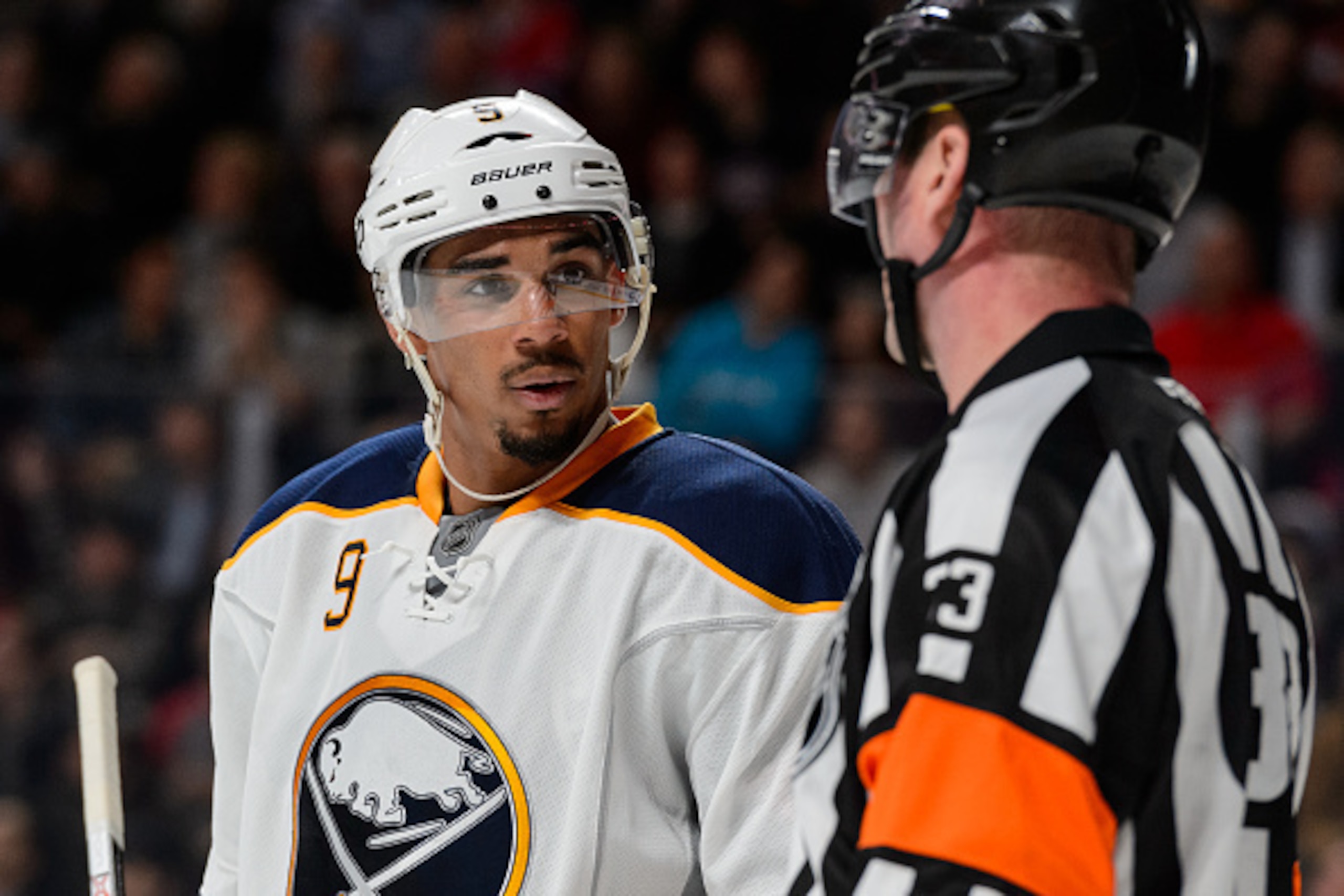 MONTREAL, QC - FEBRUARY 03:  Evander Kane #9 of the Buffalo Sabres speaks with referee Kevin Pollock #33 during the NHL game against the Montreal Canadiens at the Bell Centre on February 3, 2016 in Montreal, Quebec, Canada.  The Buffalo Sabres defeated th