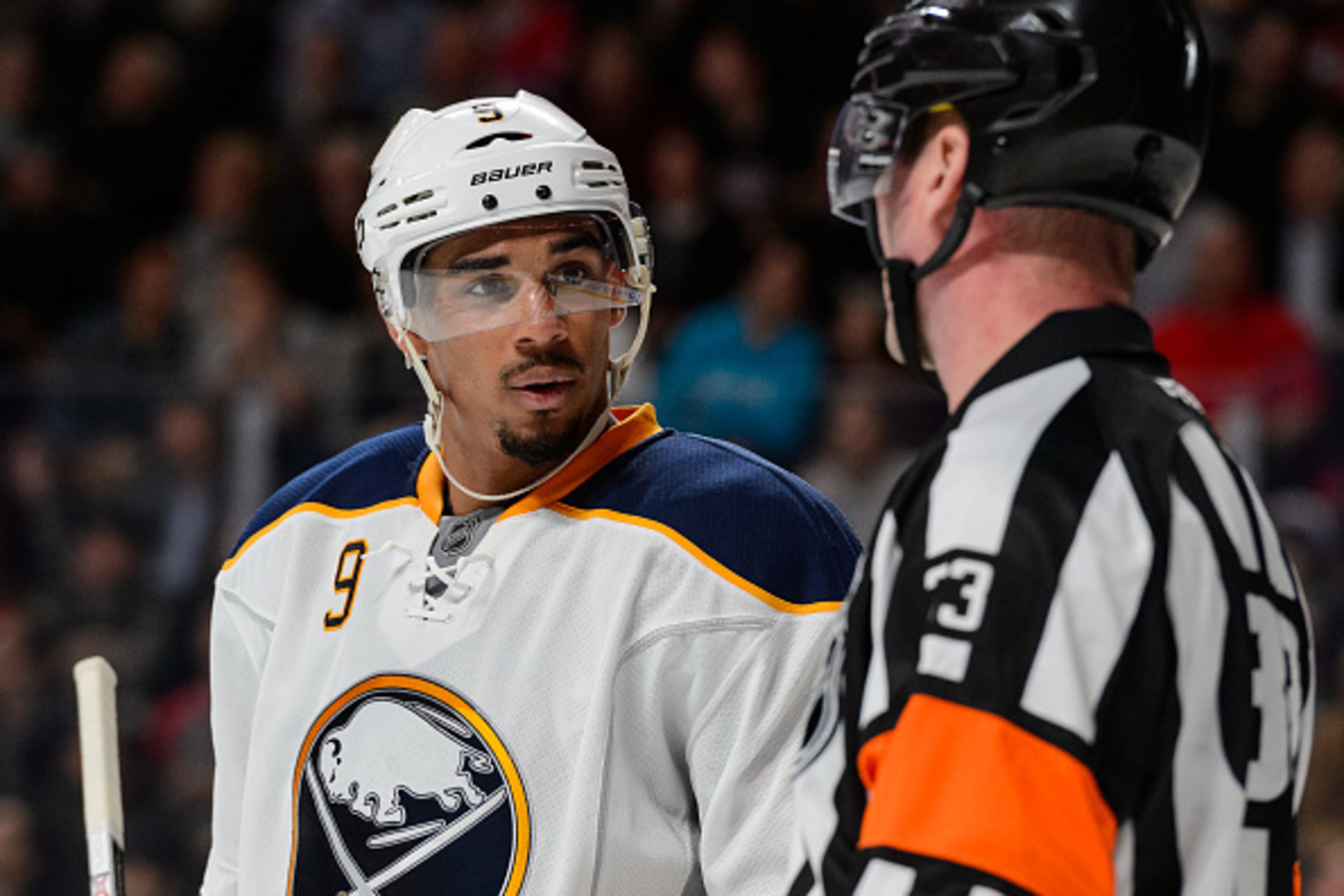 MONTREAL, QC - FEBRUARY 03:  Evander Kane #9 of the Buffalo Sabres speaks with referee Kevin Pollock #33 during the NHL game against the Montreal Canadiens at the Bell Centre on February 3, 2016 in Montreal, Quebec, Canada.  The Buffalo Sabres defeated th