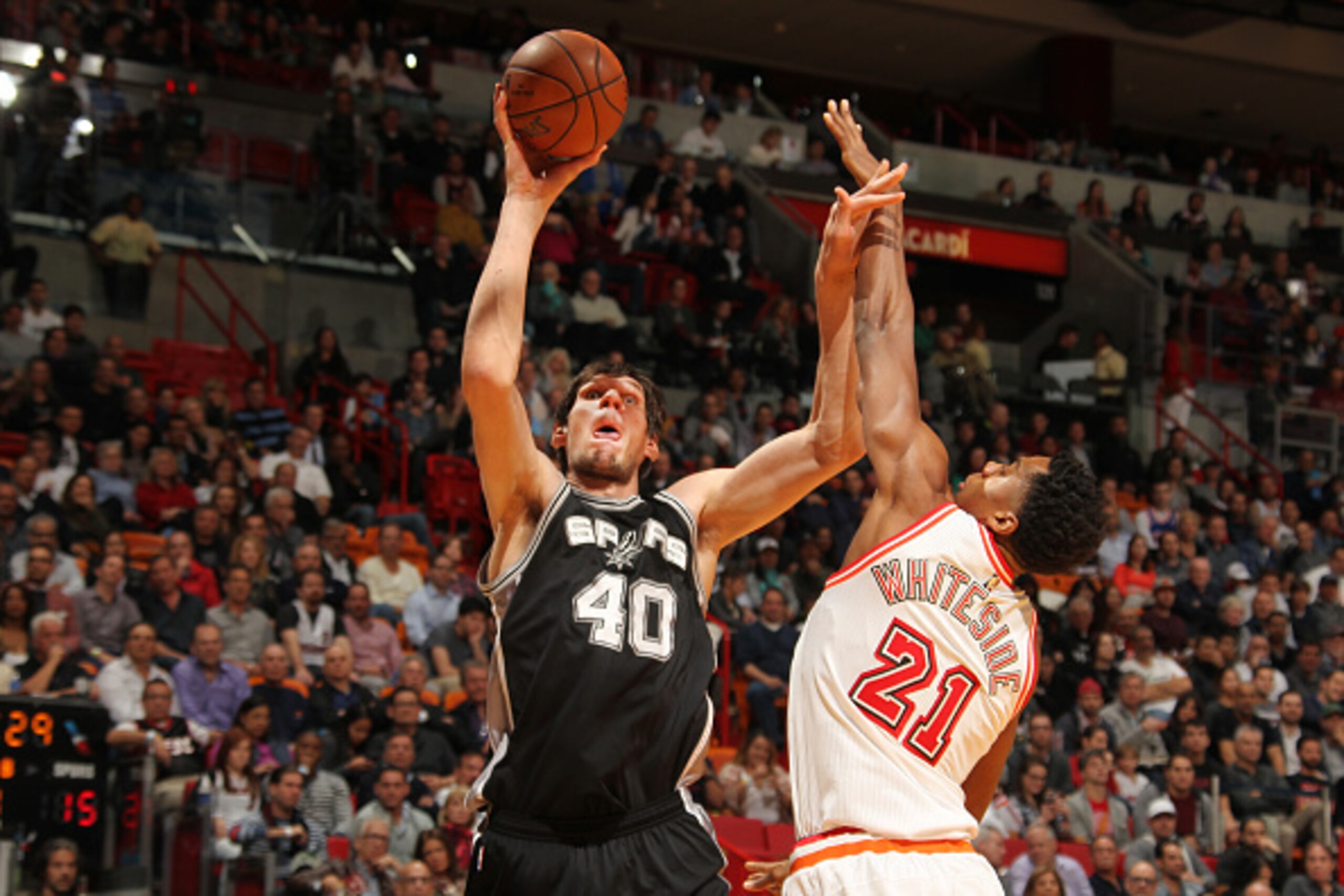 MIAMI, FL - FEBRUARY 9:  Boban Marjanovic #40 of the San Antonio Spurs shoots the ball against Hassan Whiteside #21 of the Miami Heat on February 9, 2016 at American Airlines Arena in Miami, Florida. NOTE TO USER: User expressly acknowledges and agrees th
