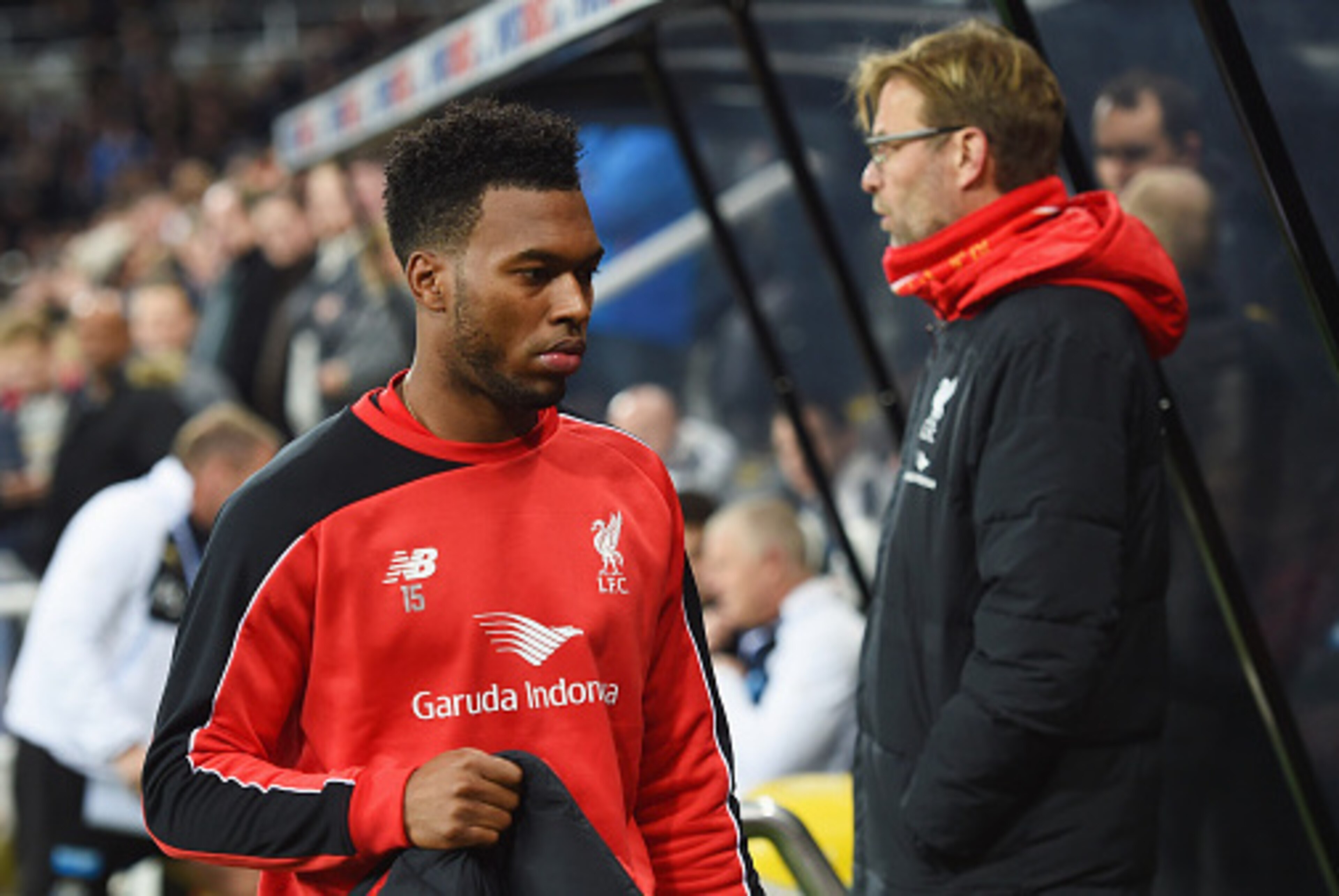 NEWCASTLE UPON TYNE, ENGLAND - DECEMBER 06:  Substitute Daniel Sturridge of Liverpool walks to the bench past Jurgen Klopp manager of Liverpool prior to the Barclays Premier League match between Newcastle United and Liverpool at St James' Park on December