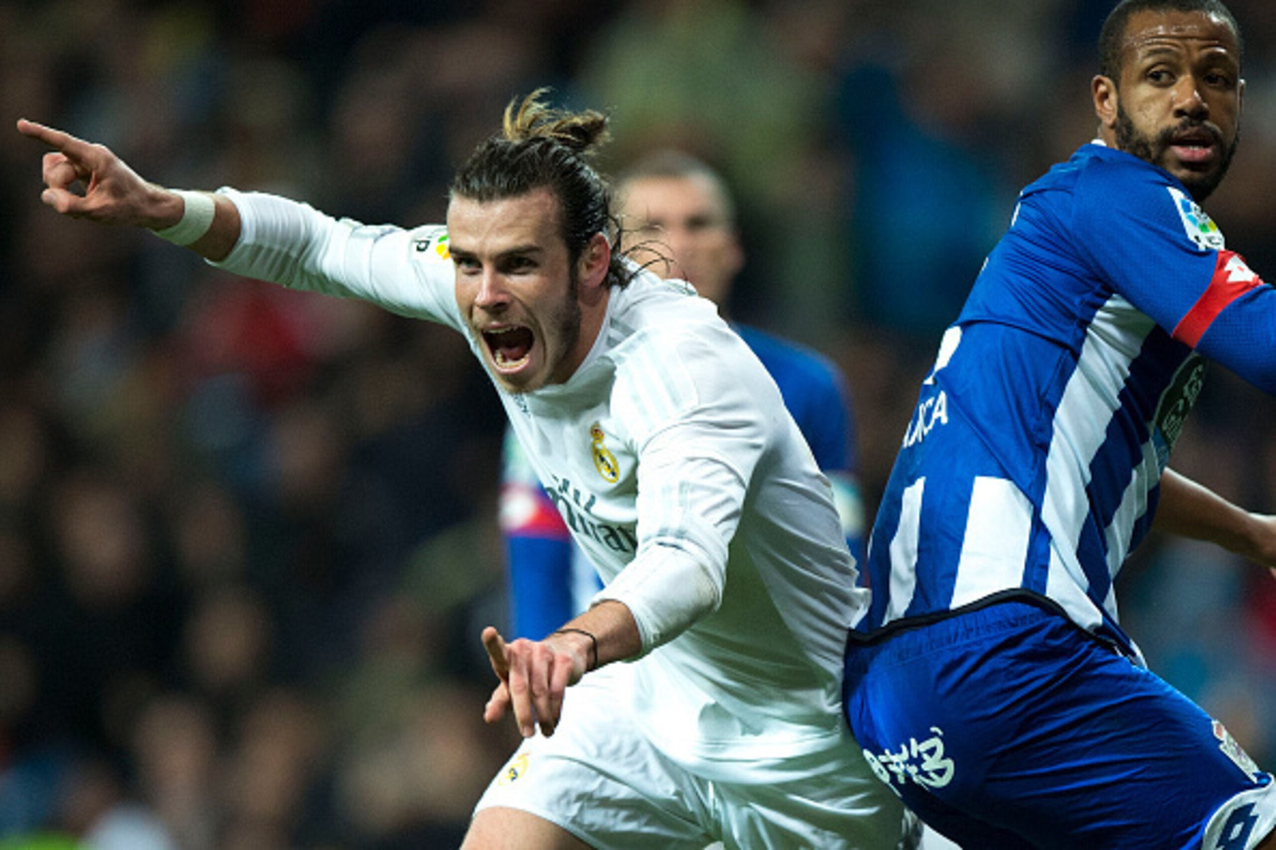 Real Madrid's Welsh forward Gareth Bale (L) celebrates a goal next to Deportivo La Coruna's Brazilian defender Sidnei during the Spanish league football match Real Madrid CF vs RC Deportivo de la Coruna at the Santiago Bernabeu stadium in Madrid on Januar Real Madrid's Welsh forward Gareth Bale (L) celebrates a goal next to Deportivo La Coruna's Brazilian defender Sidnei during the Spanish league football match Real Madrid CF vs RC Deportivo de la Coruna at the Santiago Bernabeu stadium in Madrid on Januar