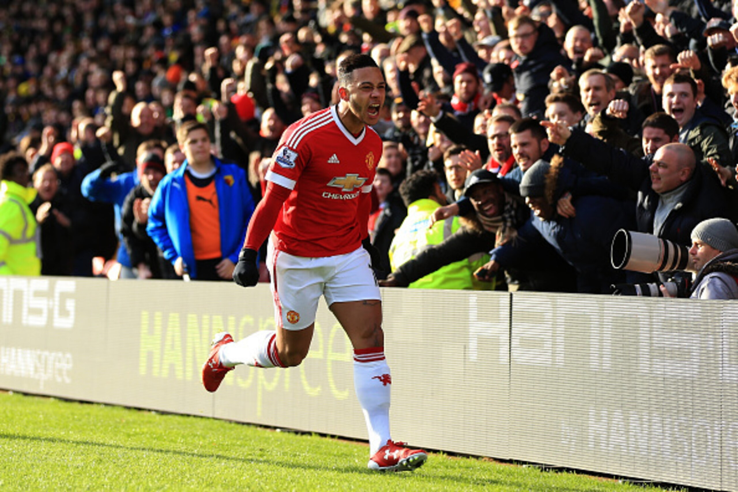 WATFORD, ENGLAND - NOVEMBER 21: Memphis Depay of Manchester United celebrates scoring his team's first goal during the Barclays Premier League match between Watford and Manchester United at Vicarage Road on November 21, 2015 in Watford, England.  (Photo b