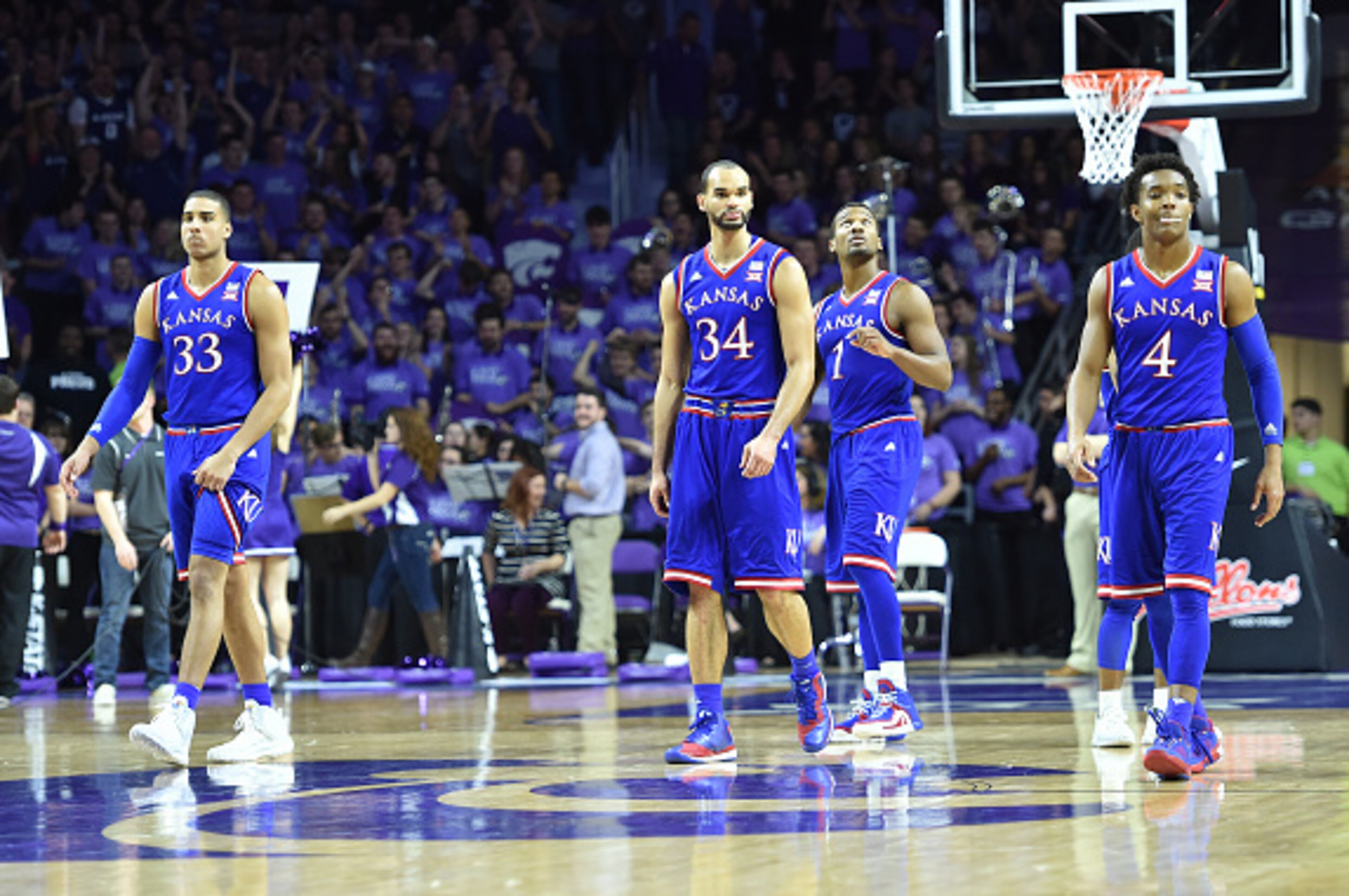 MANHATTAN, KS - FEBRUARY 20:  Players Perry Ellis #34, Devonte Graham #4, Landen Lucas #33 and Wayne Selden Jr. #1 of the Kansas Jayhawks walks down the court against the Kansas State Wildcats during the second half on February 20, 2016 at Bramlage Colise
