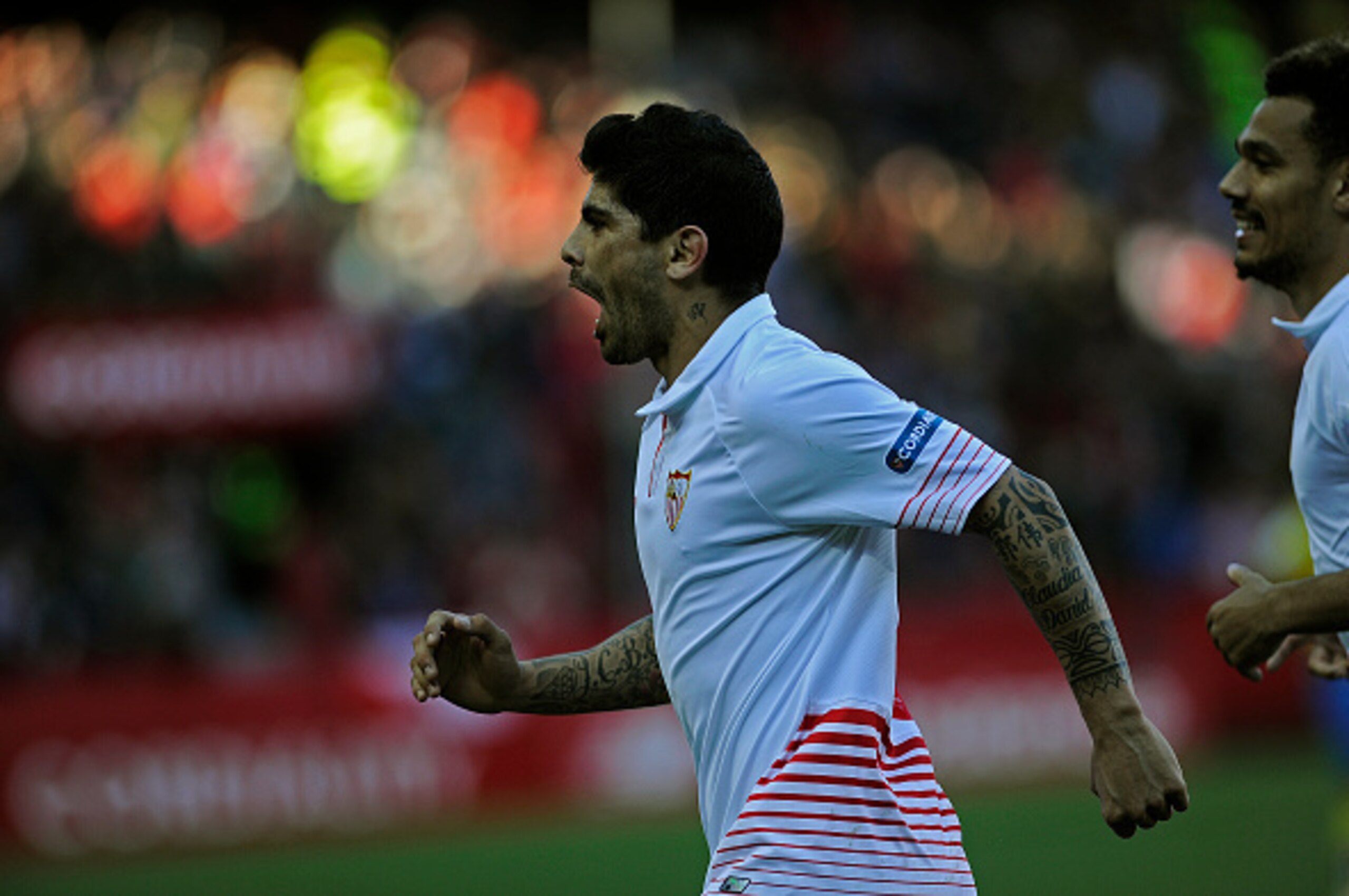 Sevilla's Argentinian midfielder Ever Banega celebrates after scoring during the Spanish league football match FC Sevilla vs UD Las Palmas at the Ramon Sanchez Pizjuan stadium in Sevilla on February 14, 2016.  / AFP / CRISTINA QUICLER        (Photo credit