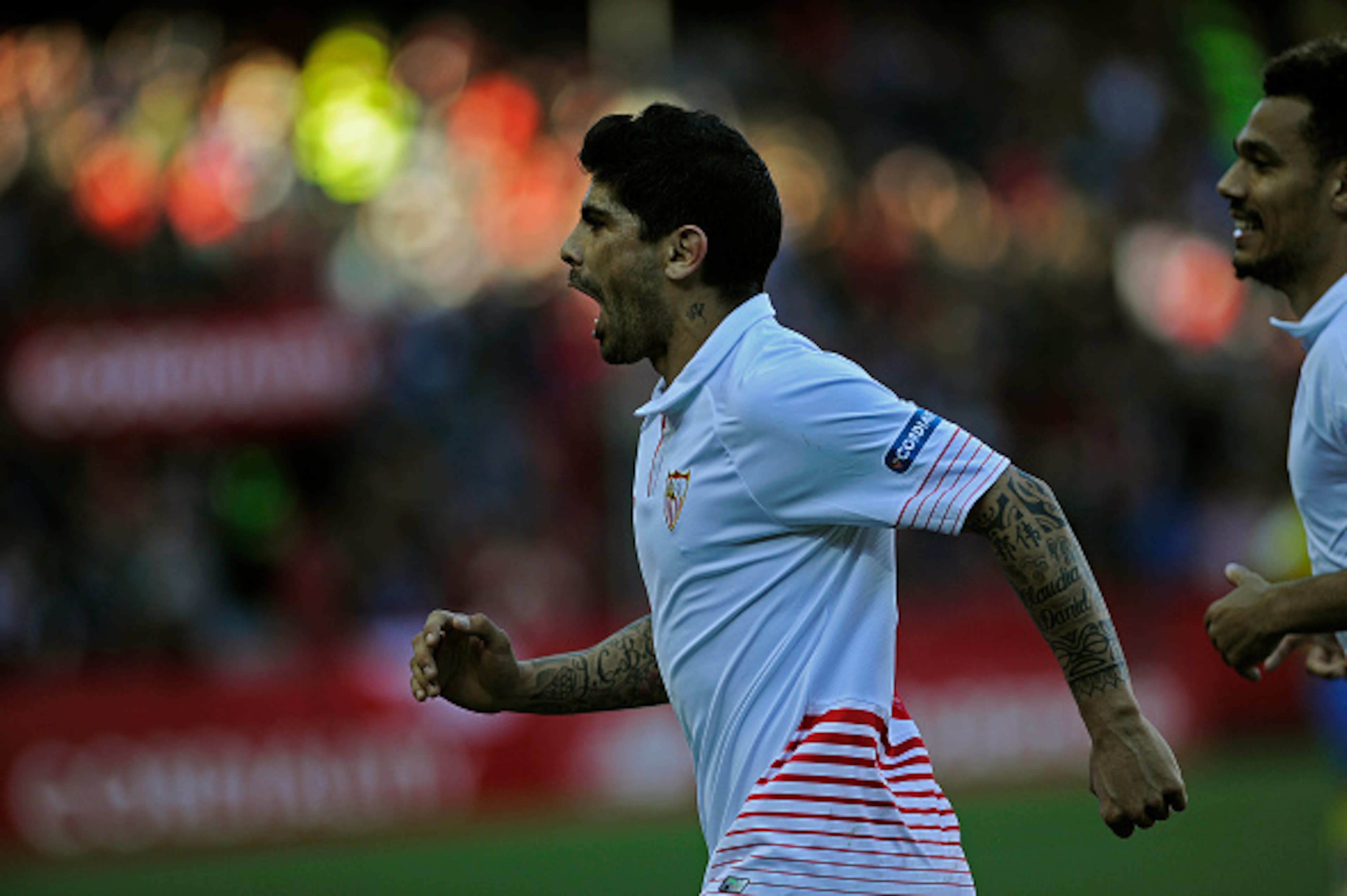 Sevilla's Argentinian midfielder Ever Banega celebrates after scoring during the Spanish league football match FC Sevilla vs UD Las Palmas at the Ramon Sanchez Pizjuan stadium in Sevilla on February 14, 2016.  / AFP / CRISTINA QUICLER        (Photo credit