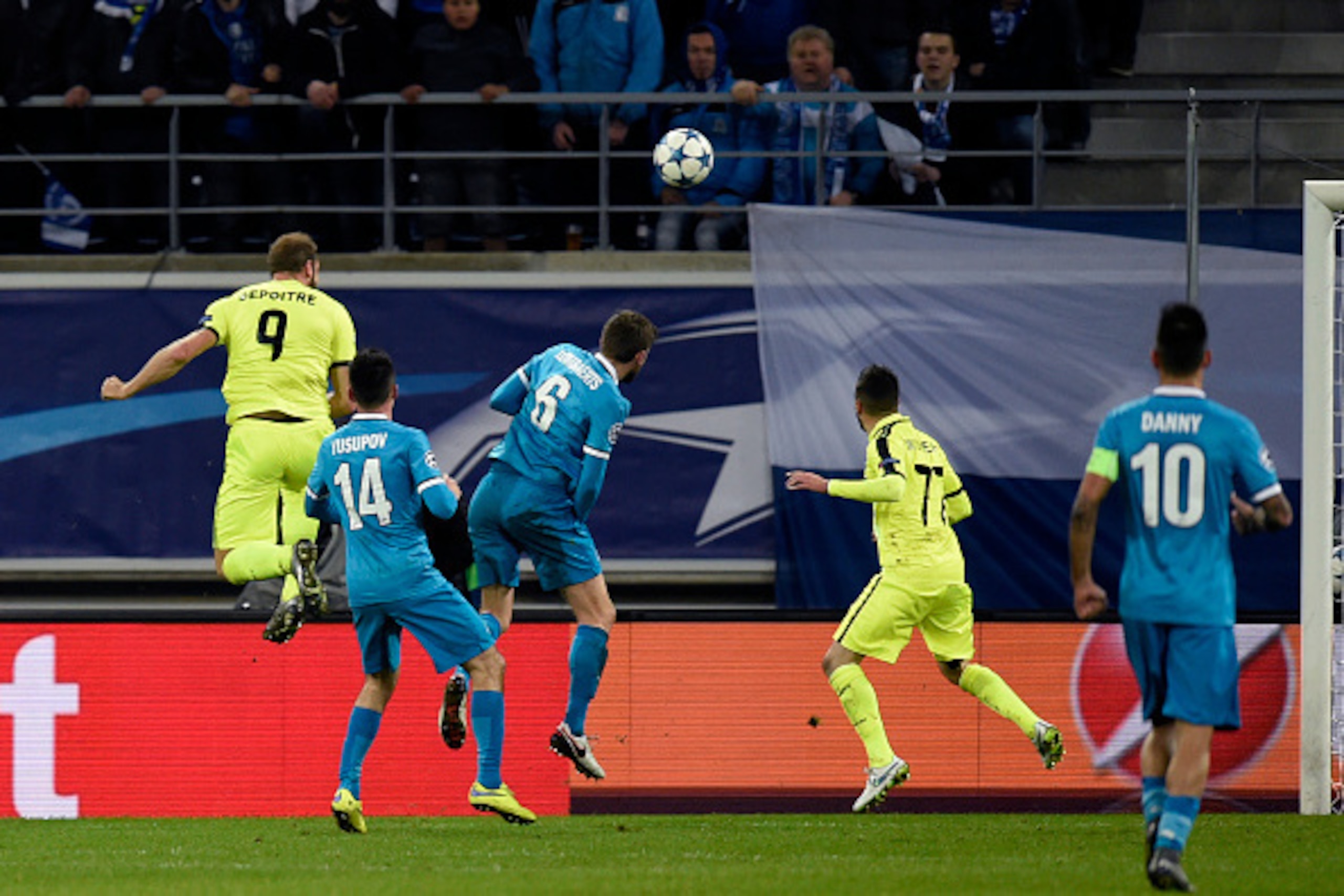 Gent's Belgium forward Laurent Depoitre (L-9) heads a goal during the UEFA Champions' League Group H football match between KAA Gent and FC Zenit on December 9, 2015 at the KAA Gent Stadium in Gent. AFP PHOTO / JOHN THYS / AFP / JOHN THYS (Photo cr Gent's Belgium forward Laurent Depoitre (L-9) heads a goal during the UEFA Champions' League Group H football match between KAA Gent and FC Zenit on December 9, 2015 at the KAA Gent Stadium in Gent. AFP PHOTO / JOHN THYS / AFP / JOHN THYS (Photo cr