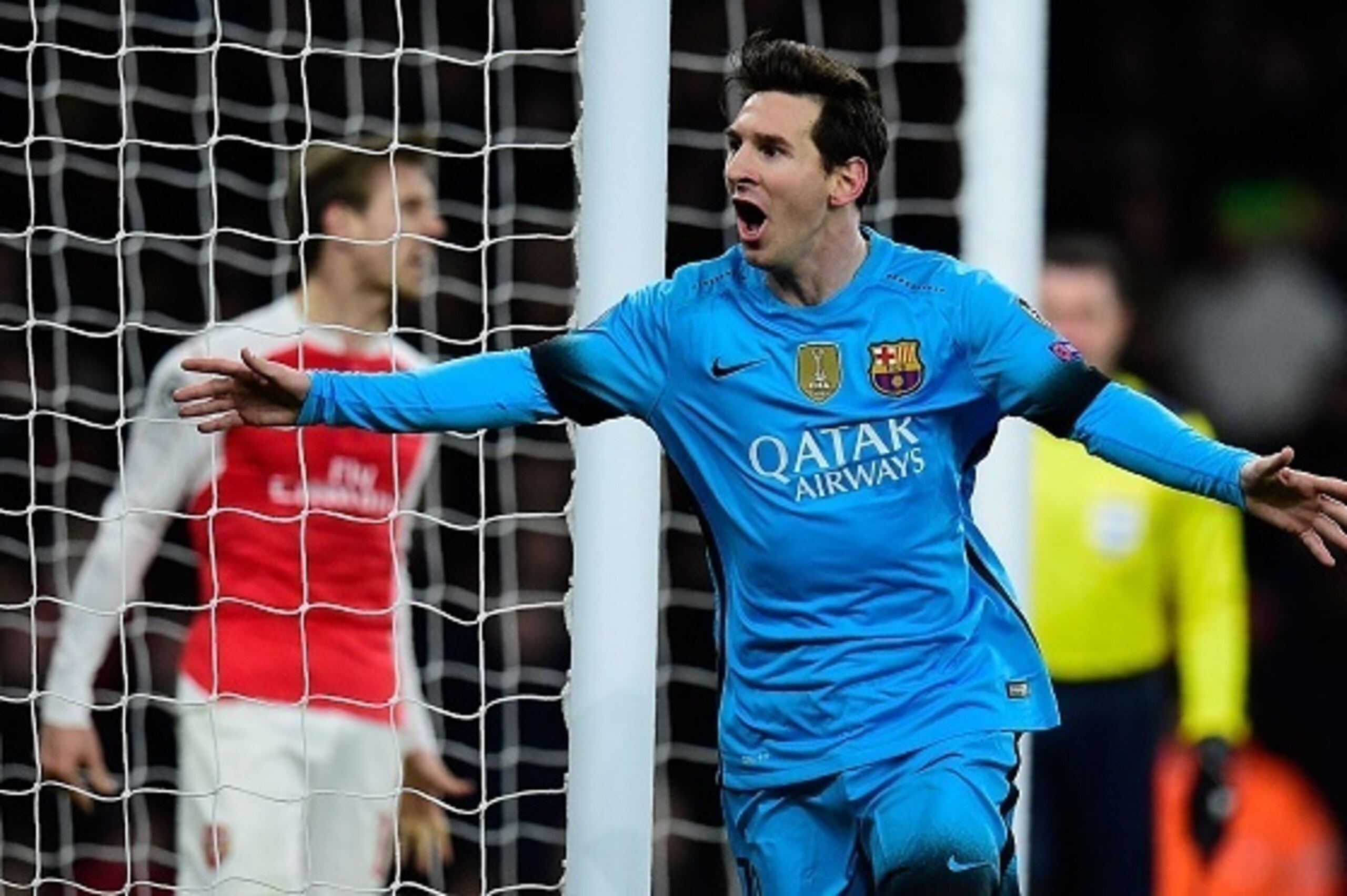Barcelona's Argentinian forward Lionel Messi celebrates scoring his team's first goal during the UEFA Champions League round of 16 1st leg football match between Arsenal and Barcelona at the Emirates Stadium in London on February 23, 2016. 

Barcelona won