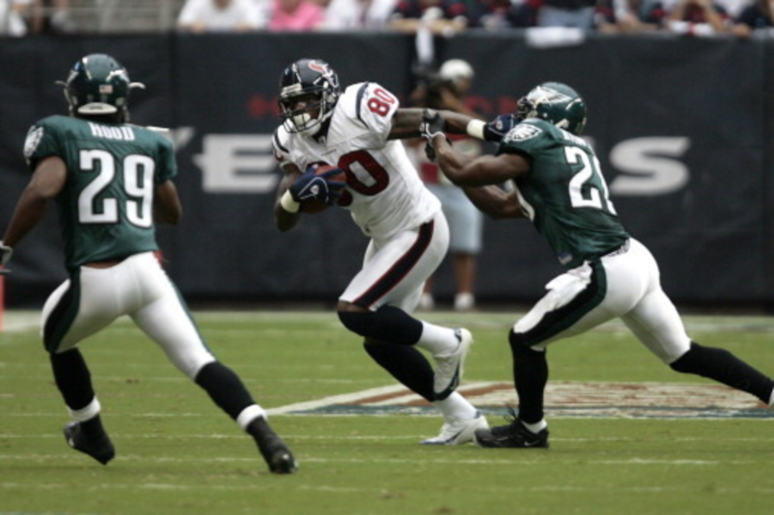 Houston Texans wide receiver Andre Johnson (80) stiff arms Philadelphia Eagles safety Brian Dawkins (20) after making a reception. The Philadelphia Eagles defeated the Houston Texans 24-10, Sept. 10, 2006 at Reliant  Stadium in Houston, Texas. (Photo by B