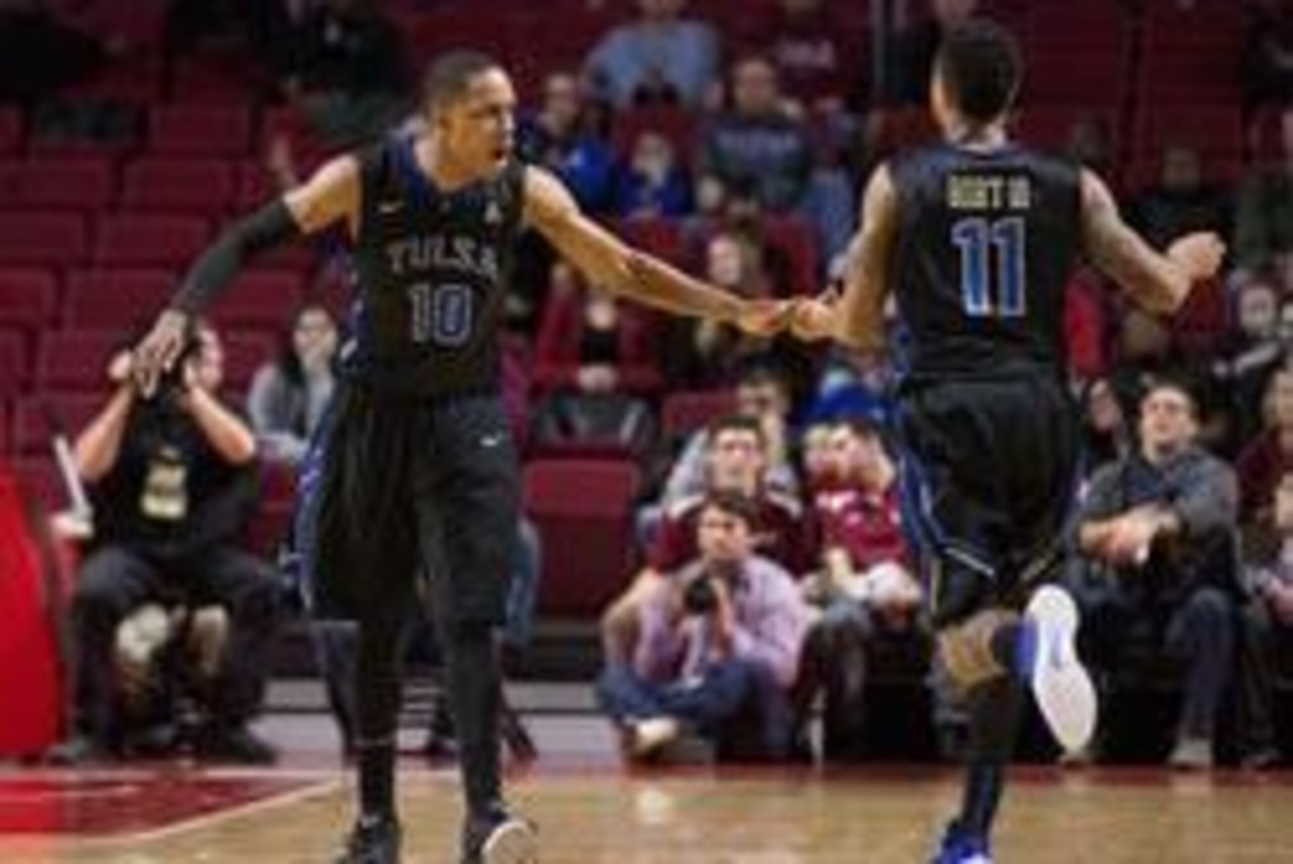 Feb 4, 2016; Philadelphia, PA, USA; Tulsa Golden Hurricane guard James Woodard (10) and guard Pat Birt (11) react after a score against the Temple Owls during the second half at Liacouras Center. The Temple Owls won 83-79 in overtime. Mandatory Credit: Bi
