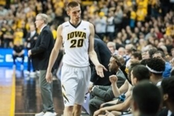 Jan 31, 2016; Iowa City, IA, USA; Iowa Hawkeyes forward Jarrod Uthoff (20) high fives teammates on the bench during the second half against the Northwestern Wildcats at Carver-Hawkeye Arena. The Hawkeyes won 85-71. Mandatory Credit: Jeffrey Becker-USA TOD