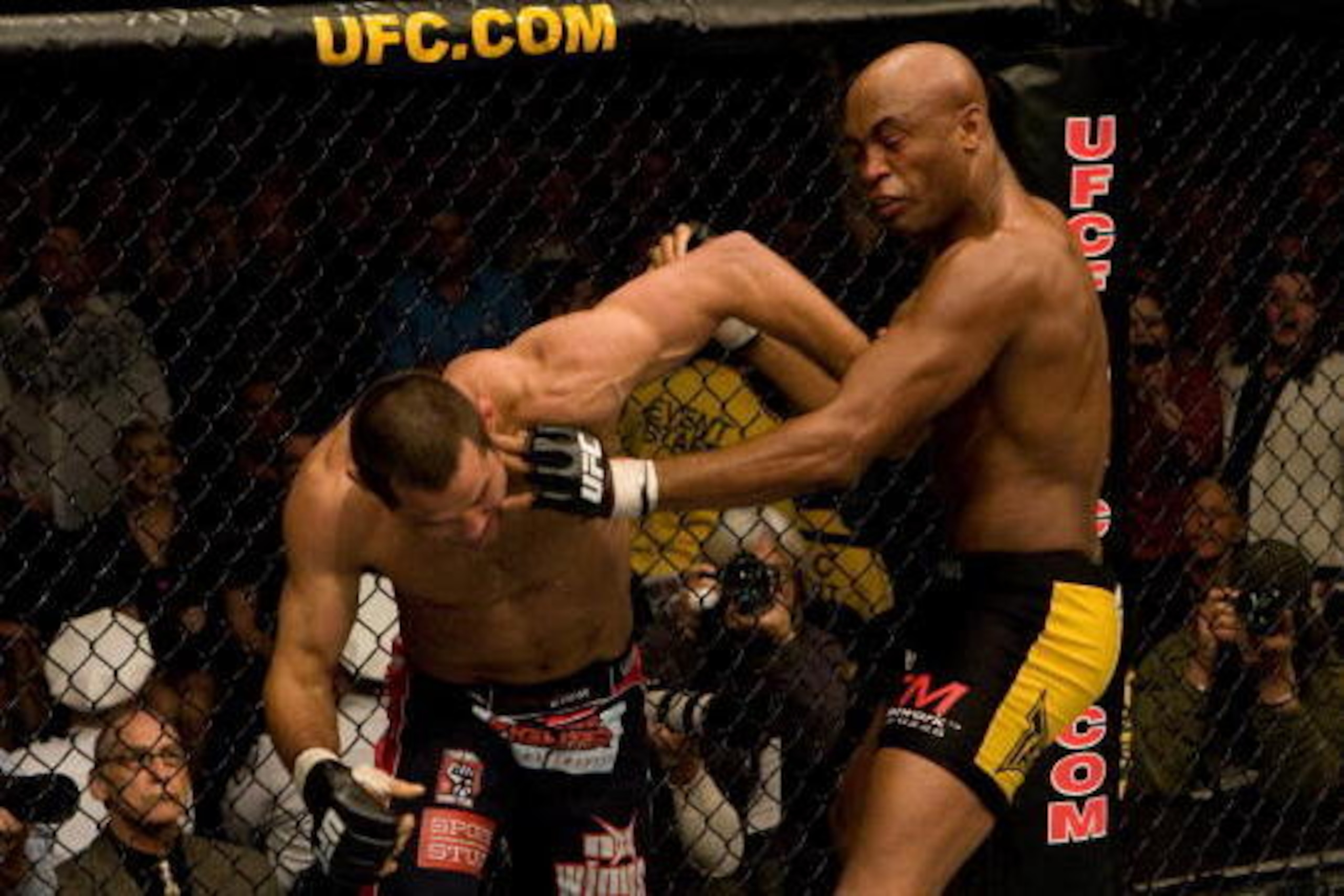 COLUMBUS,OH - MARCH 1: Anderson Silva (black/yellow tight shorts) def. Dan Henderson (blue/orange shorts) - Submission (rear naked choke) - 4:52 round 2 during the UFC 82 - Pride of a Champion at Nationwide Arena on March 1,2008 in Columbus,Ohio. (Photo COLUMBUS,OH - MARCH 1: Anderson Silva (black/yellow tight shorts) def. Dan Henderson (blue/orange shorts) - Submission (rear naked choke) - 4:52 round 2 during the UFC 82 - Pride of a Champion at Nationwide Arena on March 1,2008 in Columbus,Ohio. (Photo