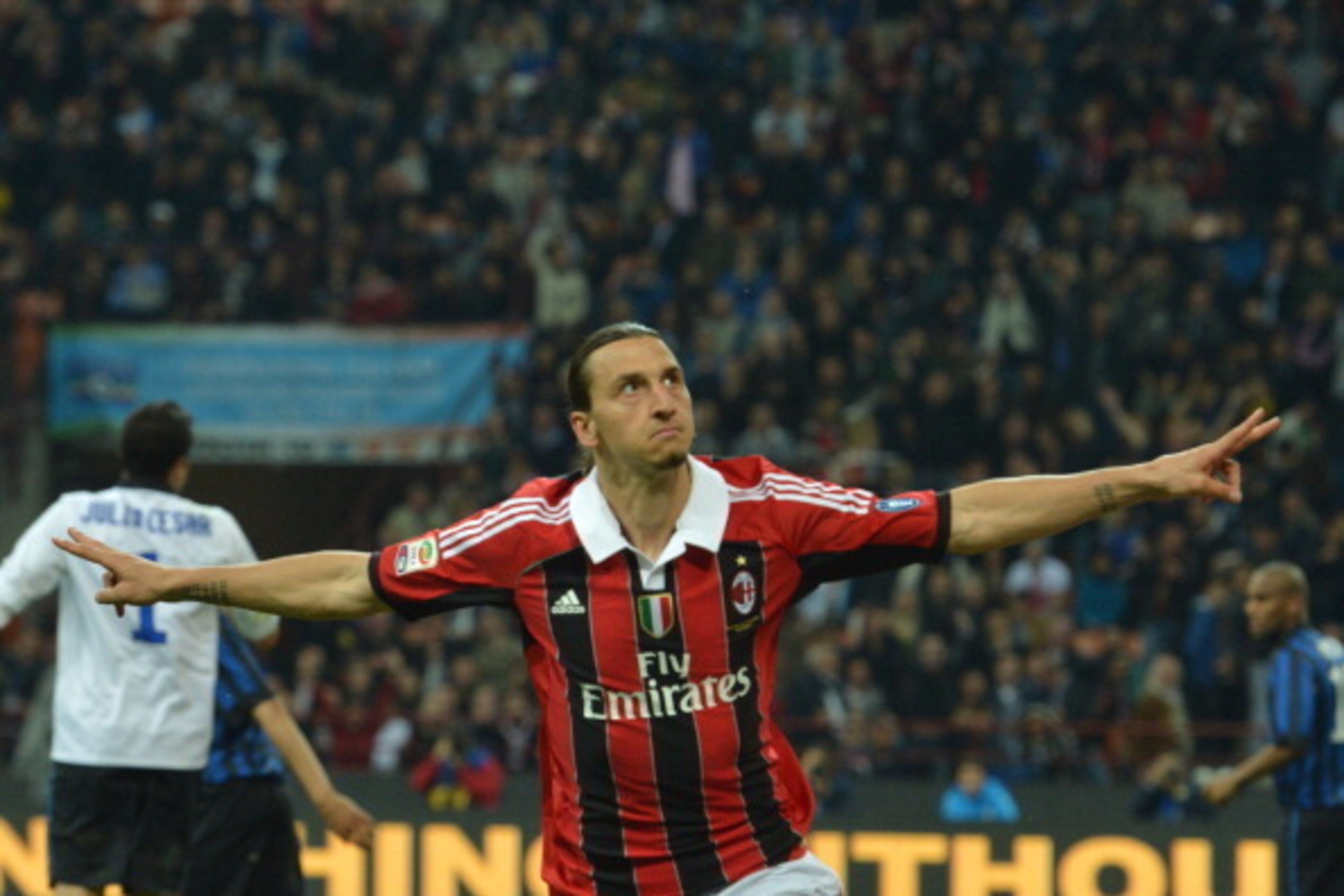 AC Milan's Swedish forward Zlatan Ibrahimovic celebrates after scoring   during their  Serie A football match between Inter Milan and AC Milan at San Siro Stadium in Milan  on May 06, 2012. AFP PHOTO / GIUSEPPE CACACE        (Photo credit should read GIUS