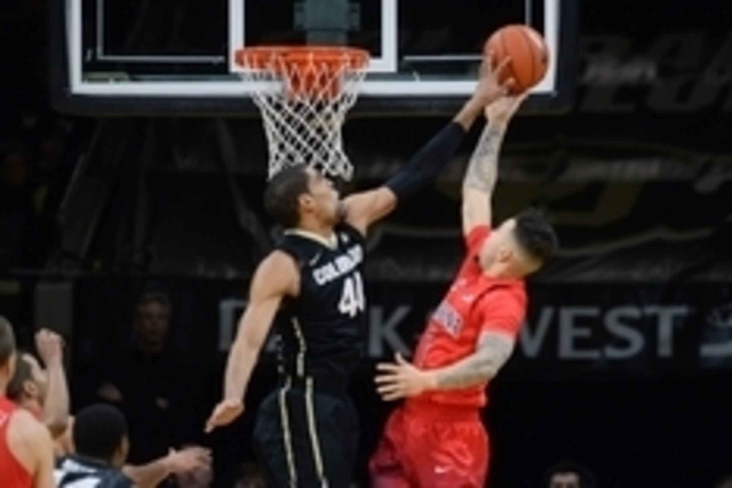 Feb 24, 2016; Boulder, CO, USA; Colorado Buffaloes forward Josh Scott (40) blocks a shot by Arizona Wildcats guard Gabe York (1) in the first half at the Coors Events Center. Mandatory Credit: Ron Chenoy-USA TODAY Sports