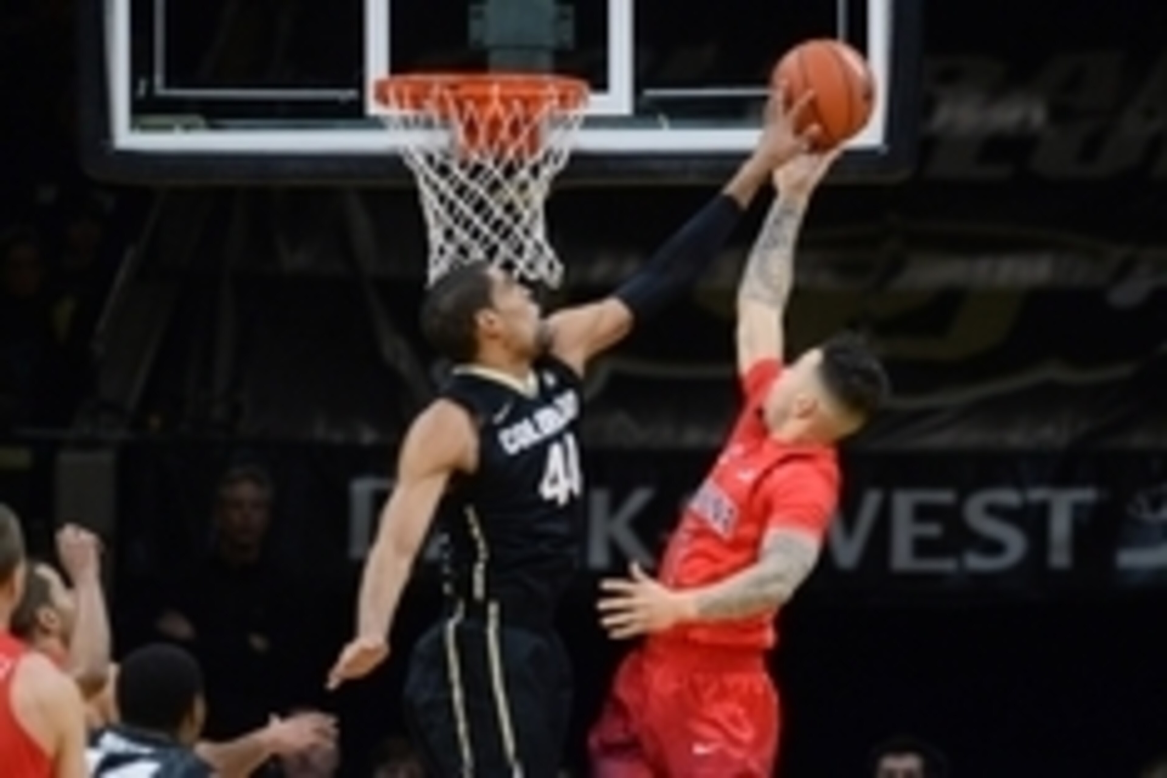 Feb 24, 2016; Boulder, CO, USA; Colorado Buffaloes forward Josh Scott (40) blocks a shot by Arizona Wildcats guard Gabe York (1) in the first half at the Coors Events Center. Mandatory Credit: Ron Chenoy-USA TODAY Sports