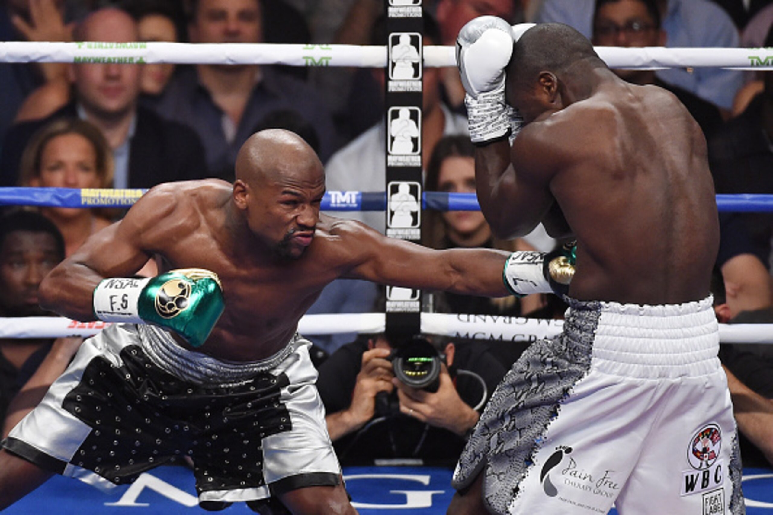 LAS VEGAS, NV - SEPTEMBER 12: Floyd Mayweather Jr. (L) throws a left at Andre Berto in the first round of their WBC/WBA welterweight title fight at MGM Grand Garden Arena on September 12, 2015 in Las Vegas, Nevada. Mayweather retained his titles with a u LAS VEGAS, NV - SEPTEMBER 12: Floyd Mayweather Jr. (L) throws a left at Andre Berto in the first round of their WBC/WBA welterweight title fight at MGM Grand Garden Arena on September 12, 2015 in Las Vegas, Nevada. Mayweather retained his titles with a u