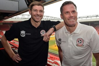 Liverpool's English captain and midfielder Steven Gerrard (L) and former Liverpool team mate Jamie Carragher attend a press conference at Anfield in Liverpool, north west England on March 12, 2015 ahead of an All-Star charity match at the stadium on March