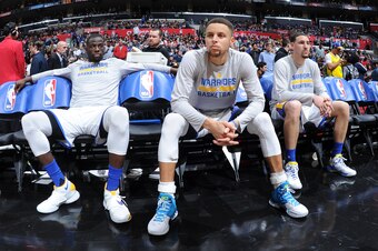 LOS ANGELES, CA - FEBRUARY 20: Draymond Green #23, Stephen Curry #30 and Klay Thompson #11 of the Golden State Warriors are seen before the game against the Los Angeles Clippers on February 20, 2016 at STAPLES Center in Los Angeles, California. NOTE TO US