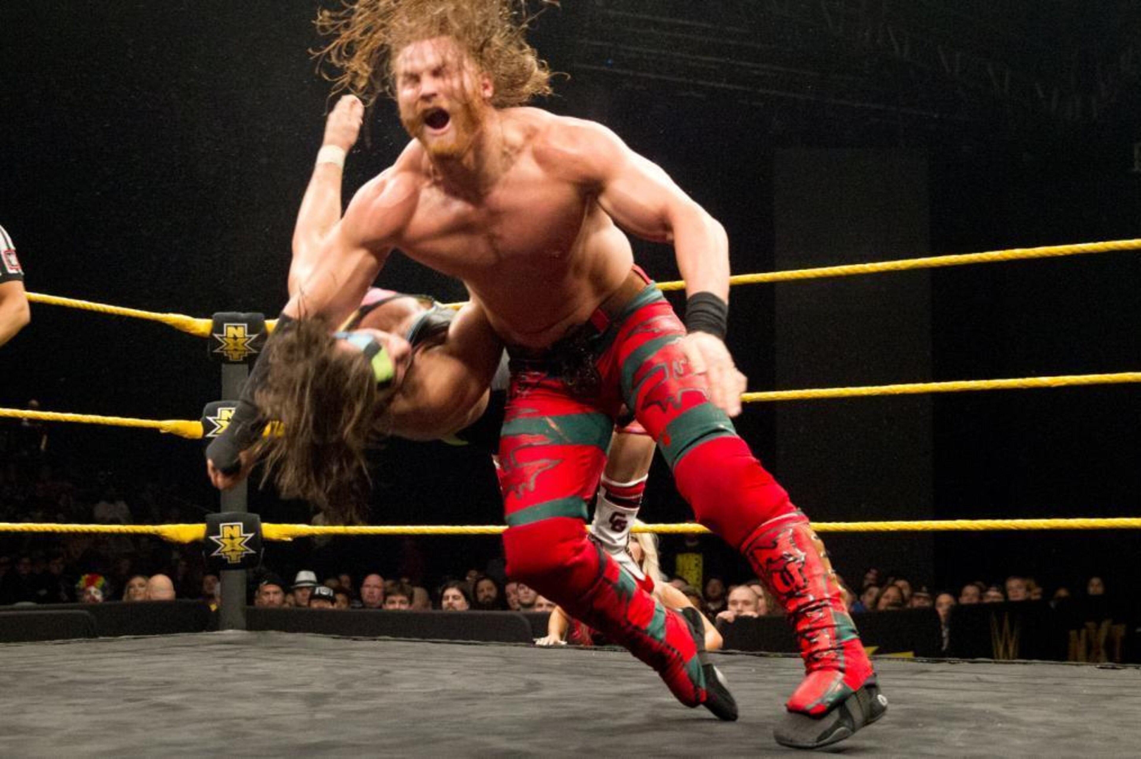 Murphy nails Chad Gable with a clothesline.