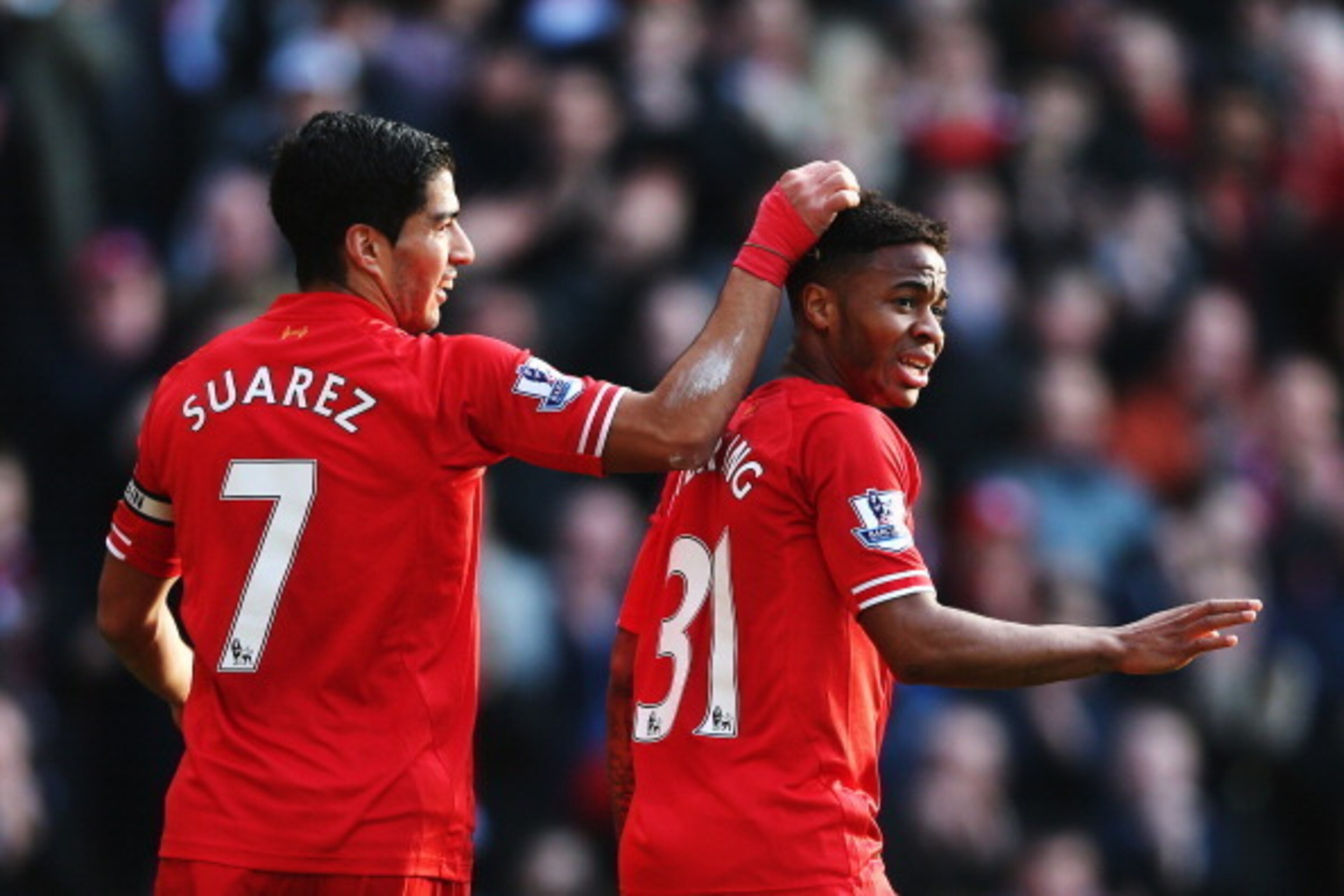 LIVERPOOL, ENGLAND - DECEMBER 21: (L-R) Luis Suarez and Raheem Sterling of Liverpool react during the Barclays Premier League match between Liverpool and Cardiff City at Anfield on December 21, 2013 in Liverpool, England. (Photo by Clive Brunskill/Getty LIVERPOOL, ENGLAND - DECEMBER 21: (L-R) Luis Suarez and Raheem Sterling of Liverpool react during the Barclays Premier League match between Liverpool and Cardiff City at Anfield on December 21, 2013 in Liverpool, England. (Photo by Clive Brunskill/Getty