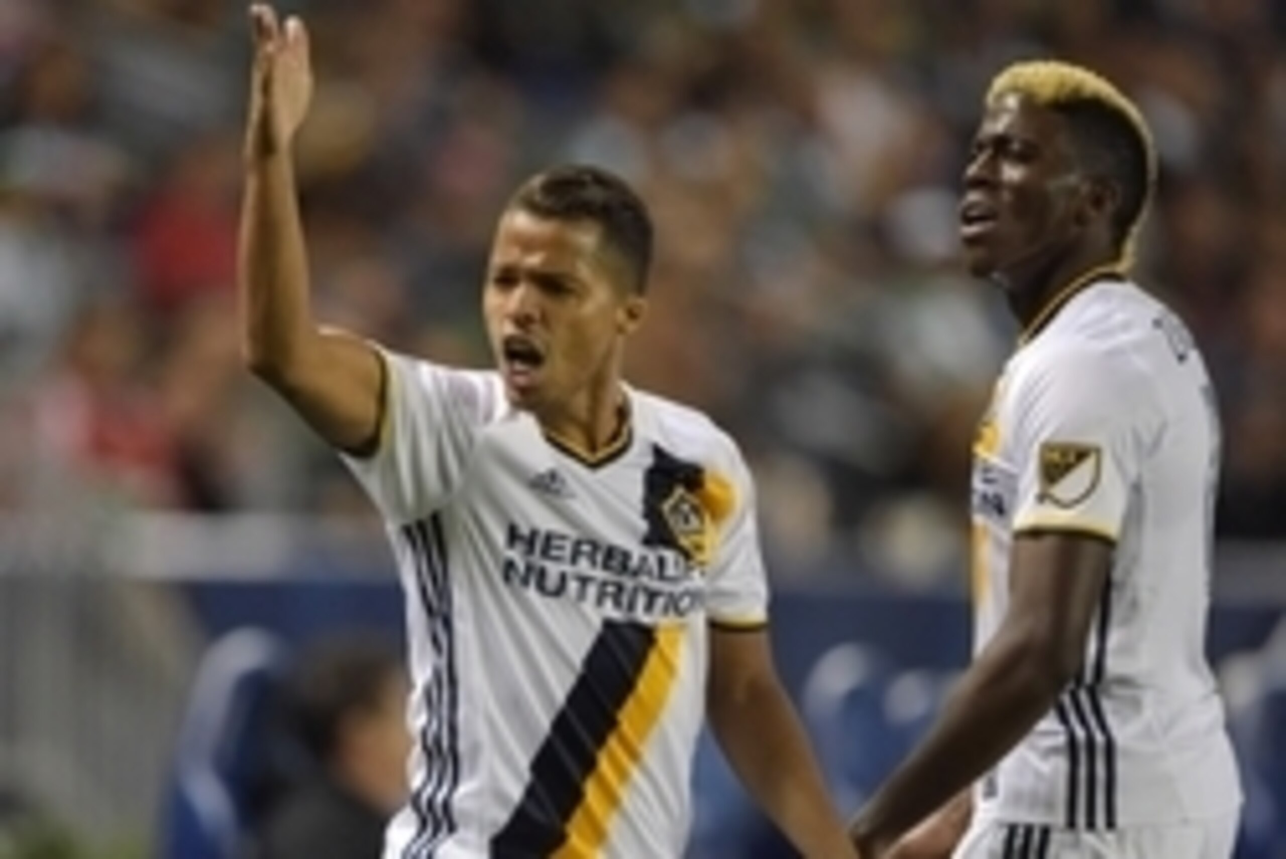 Feb 24, 2016; Carson, CA, USA; Los Angeles Galaxy players Giovani dos Santos (left) and Gyasi Zardes react during a CONCACAF Champions League match against Santos Laguna at StubHub Center. The teams played to a 0-0 tie. Mandatory Credit: Kirby Lee-USA TOD