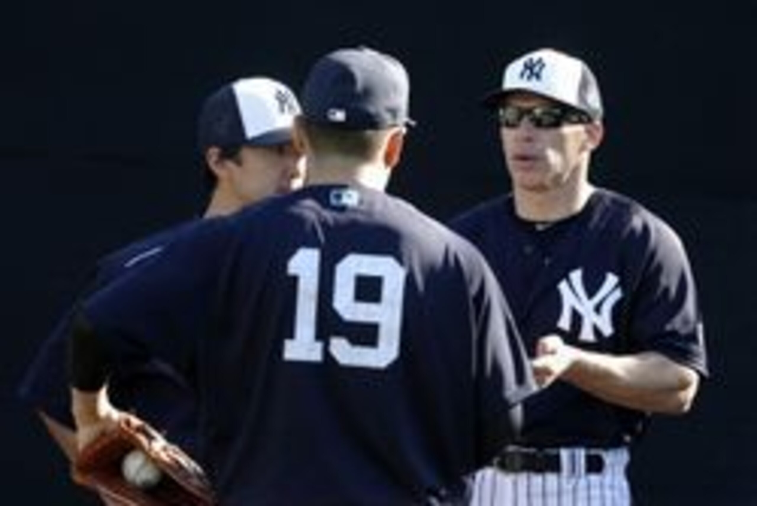 Feb 22, 2016; Tampa, FL, USA; New York Yankees manager Joe Girardi (28) talks with starting pitcher Masahiro Tanaka (19) during practice at George M. Steinbrenner Stadium. Mandatory Credit: Butch Dill-USA TODAY Sports