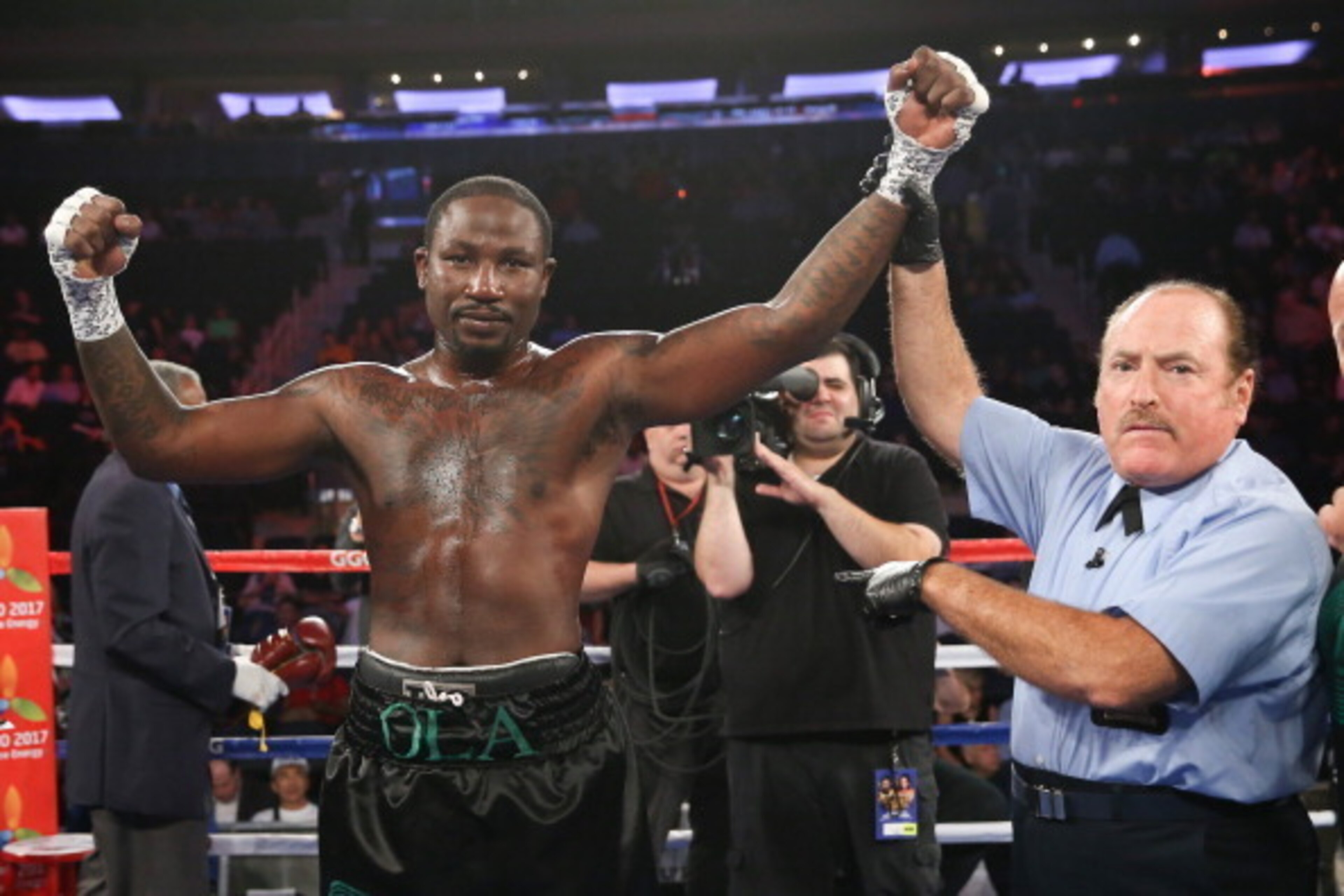 NEW YORK, NY - JULY 26: Referee Steve Smoger raises the arm of Ola Afolabi after his knockout win over Anthony Caputo Smith (not shown) during their cruiserweight bout at Madison Square Garden on July 26, 2014 in New York, New York. (Photo by Ed Mulhollan