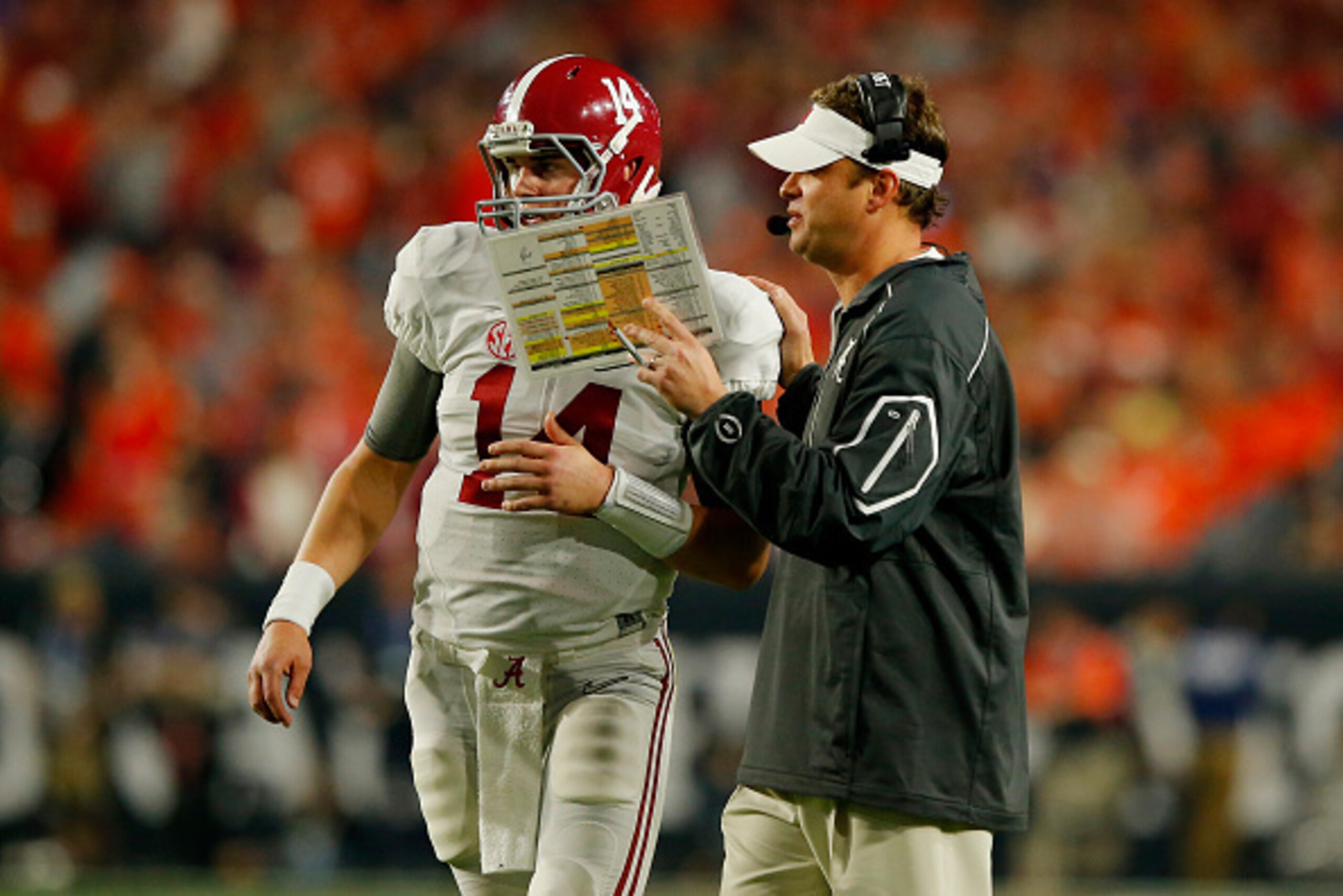 GLENDALE, AZ - JANUARY 11: Jake Coker #14 of the Alabama Crimson Tide talks with offensive coordinator Lane Kiffin in the first half while taking on the Clemson Tigers during the 2016 College Football Playoff National Championship Game at University of P GLENDALE, AZ - JANUARY 11: Jake Coker #14 of the Alabama Crimson Tide talks with offensive coordinator Lane Kiffin in the first half while taking on the Clemson Tigers during the 2016 College Football Playoff National Championship Game at University of P