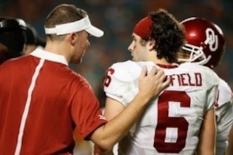 Dec 31, 2015; Miami Gardens, FL, USA; Oklahoma Sooners quarterback Baker Mayfield (6) talks with offensive coordinator and quarterback coach Lincoln Riley in the third quarter of the 2015 CFP Semifinal against the Clemson Tigers at the Orange Bowl at Sun 