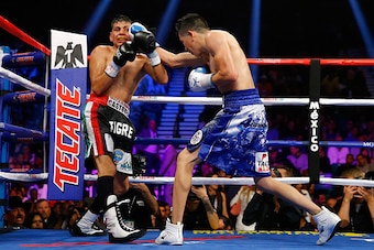 LAS VEGAS, NV - MAY 02:  Leo Santa Cruz (R) throws a right at Jose Cayetano during their featherweight bout on May 2, 2015 at MGM Grand Garden Arena in Las Vegas, Nevada.  (Photo by Al Bello/Getty Images)