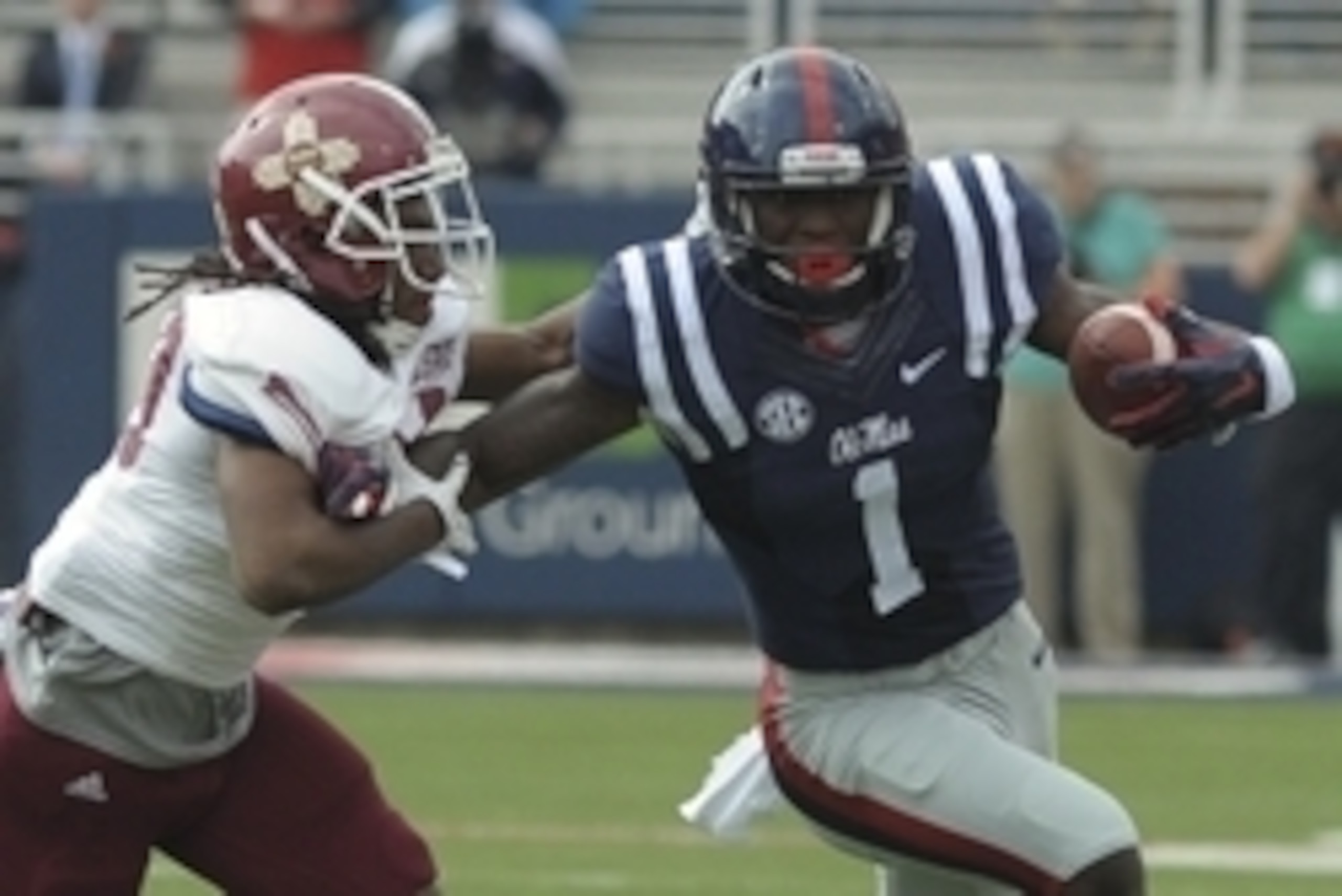 Oct 10, 2015; Oxford, MS, USA; Mississippi Rebels wide receiver Laquon Treadwell (1) carries the ball against New Mexico State Aggies defensive back Lewis Hill (29) during the game at Vaught-Hemingway Stadium. Mandatory Credit: Justin Ford-USA TODAY Sport