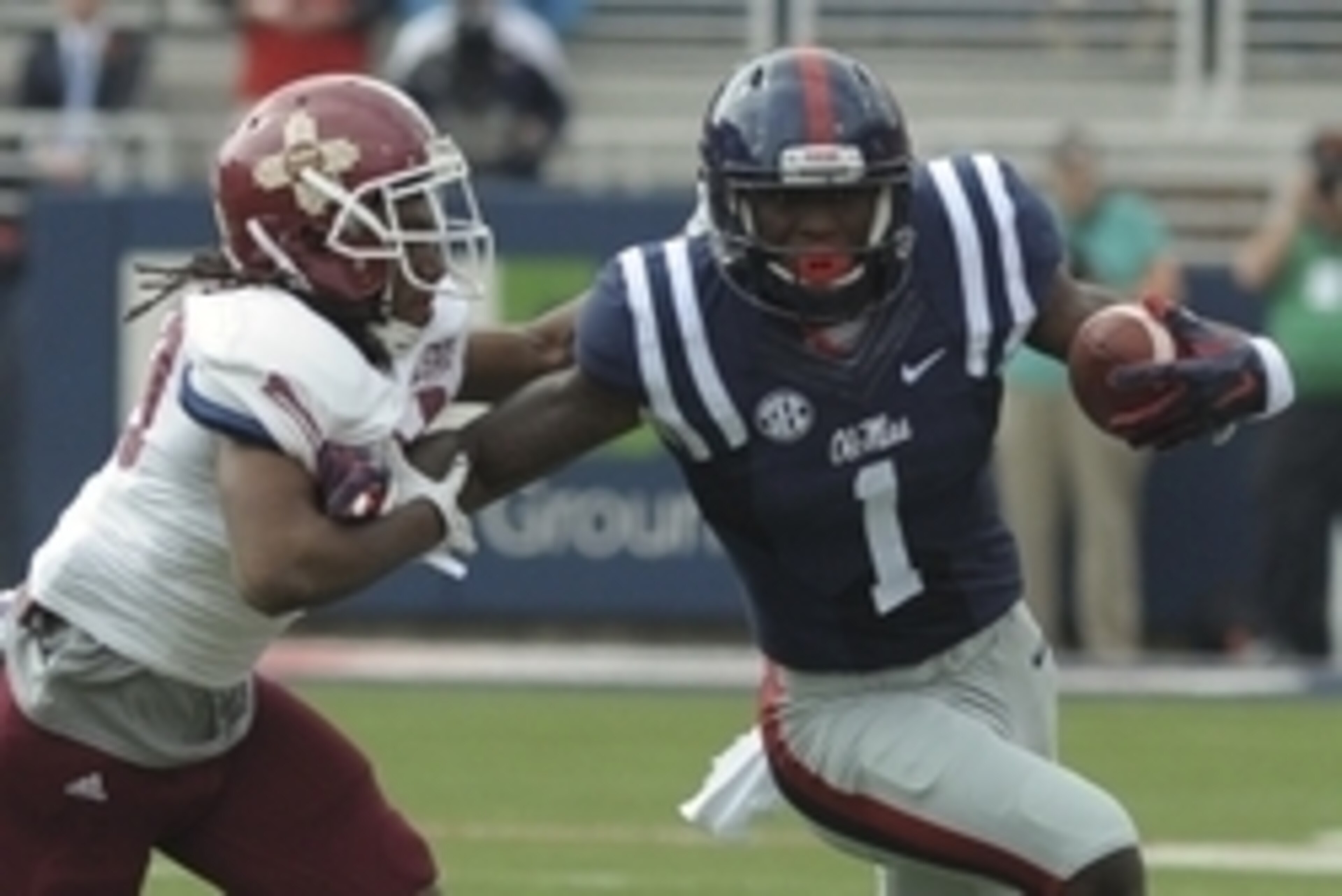 Oct 10, 2015; Oxford, MS, USA; Mississippi Rebels wide receiver Laquon Treadwell (1) carries the ball against New Mexico State Aggies defensive back Lewis Hill (29) during the game at Vaught-Hemingway Stadium. Mandatory Credit: Justin Ford-USA TODAY Sport