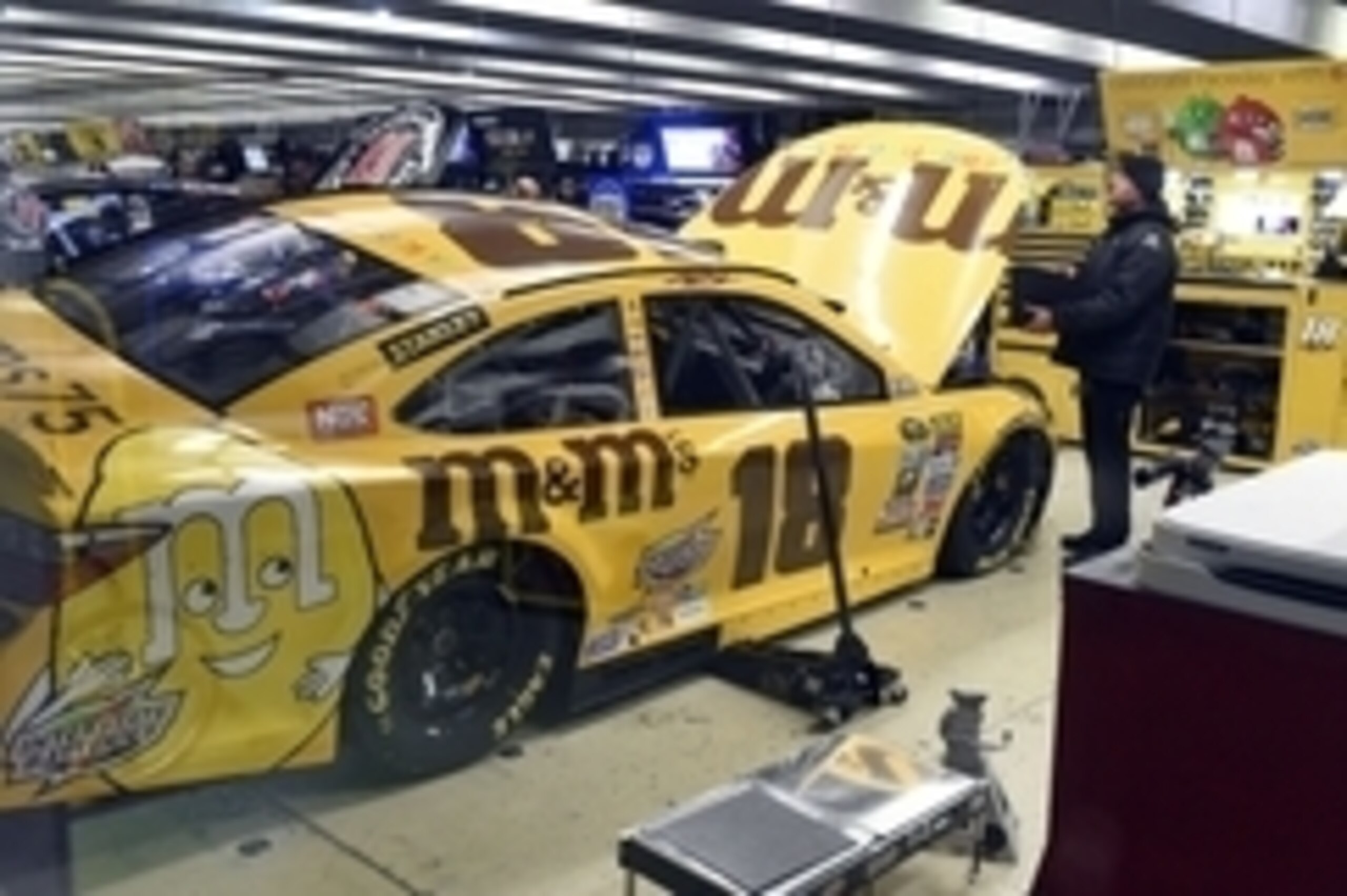 Feb 26, 2016; Hampton, GA, USA; The crew of NASCAR Sprint Cup Series driver Kyle Busch (18) work on their car after failing inspection in the garage following qualifying for the Folds of Honor QuikTrip 500 at Atlanta Motor Speedway. Kyle Busch   s pole-wi