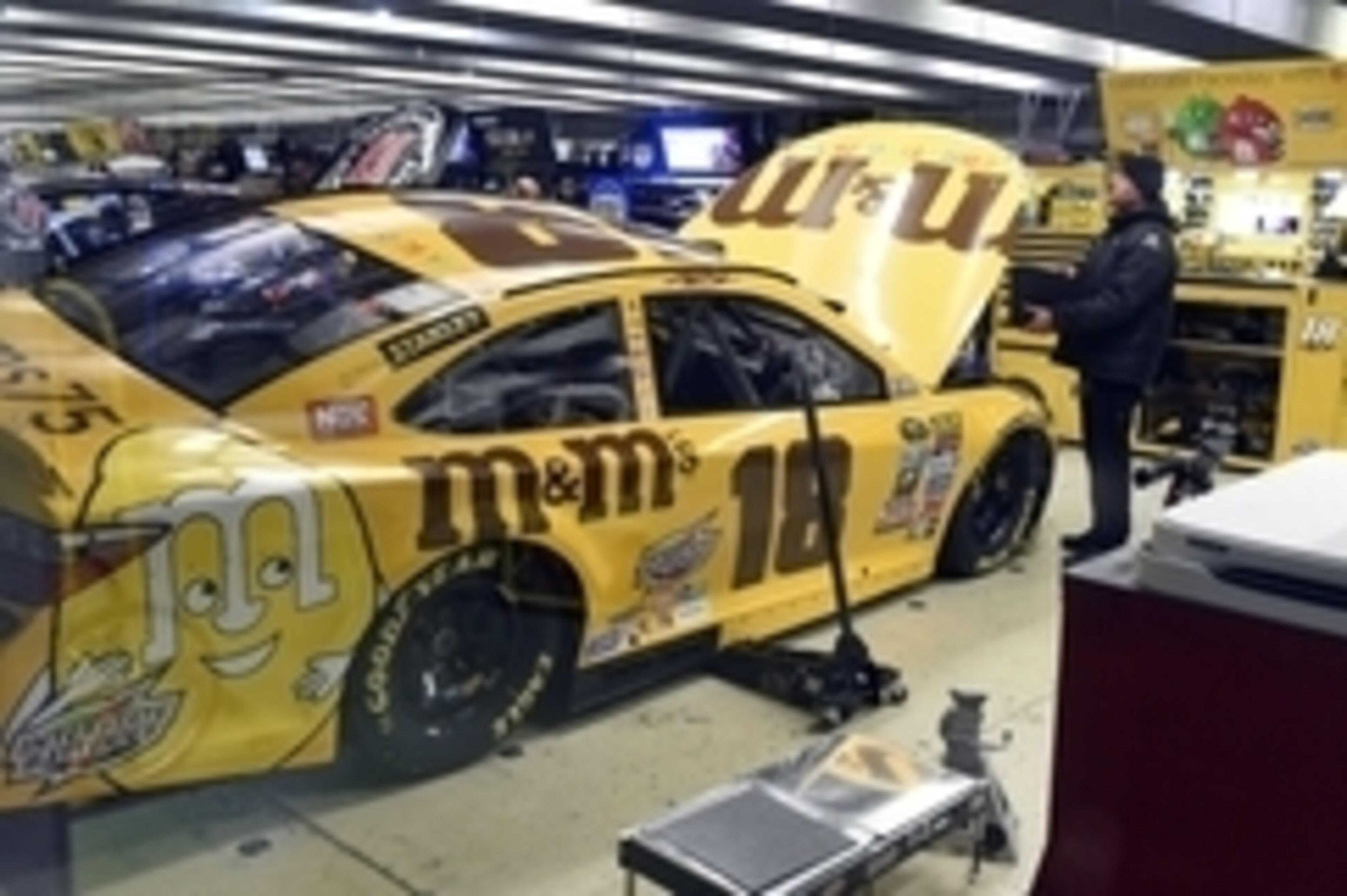 Feb 26, 2016; Hampton, GA, USA; The crew of NASCAR Sprint Cup Series driver Kyle Busch (18) work on their car after failing inspection in the garage following qualifying for the Folds of Honor QuikTrip 500 at Atlanta Motor Speedway. Kyle Busch   s pole-wi